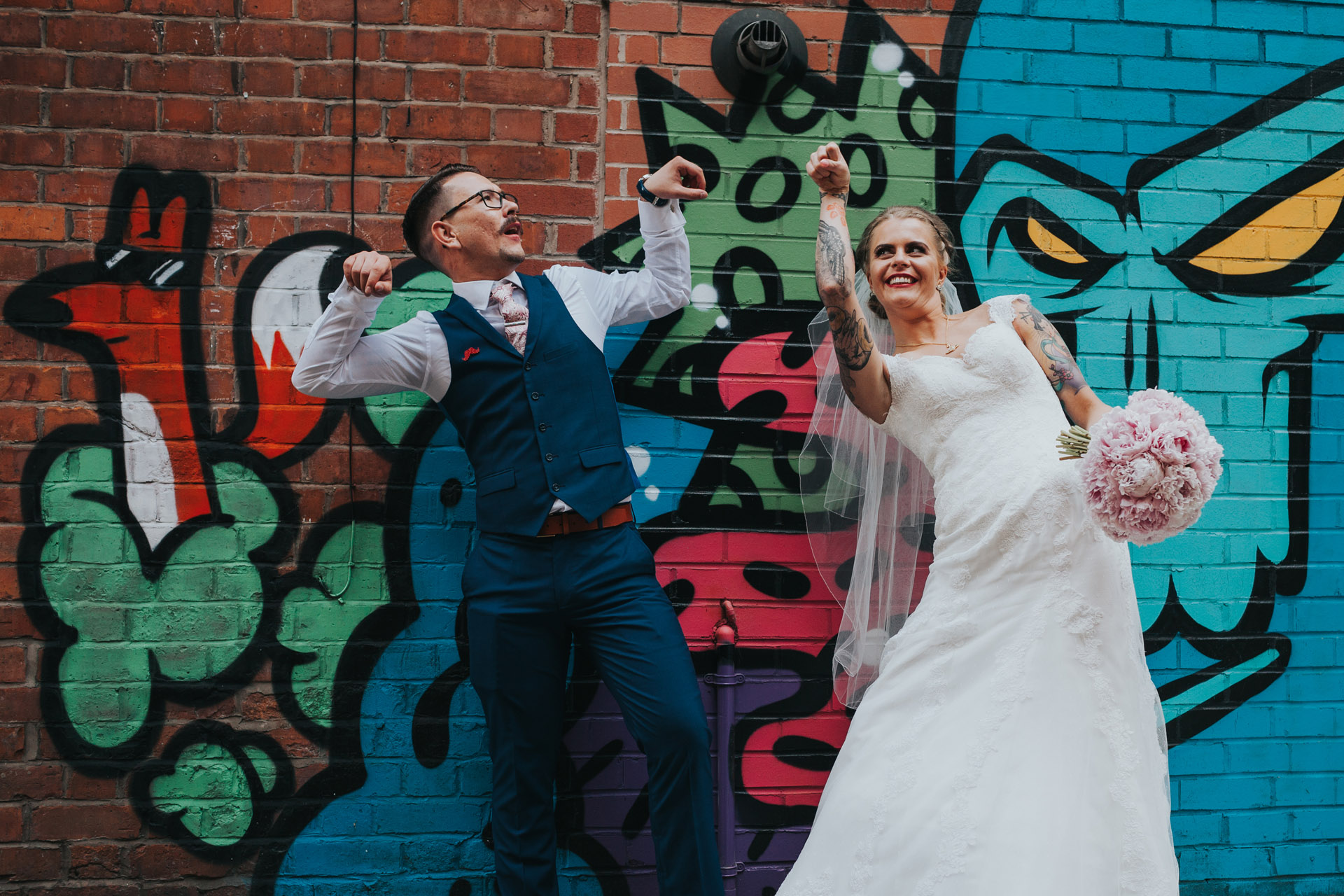 Bride and Groom having fun in Manchester alley. 