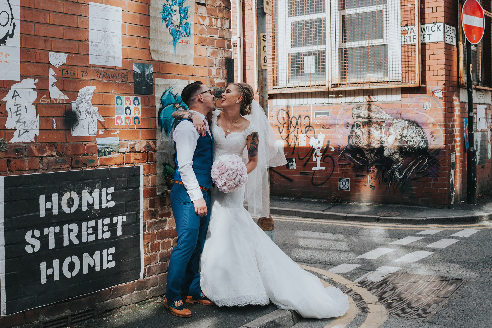 Manchester Bride and Groom pose for photographs on Warwick Street. 