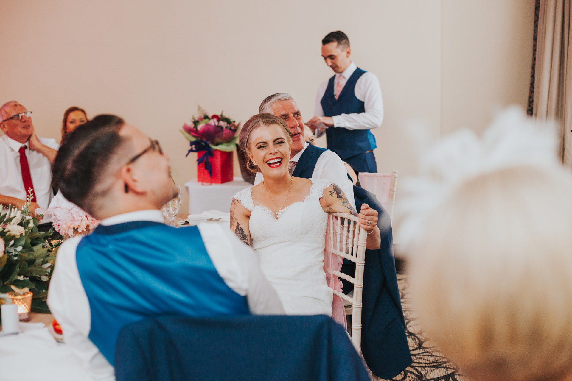 Bride laughing at best mans speech. 