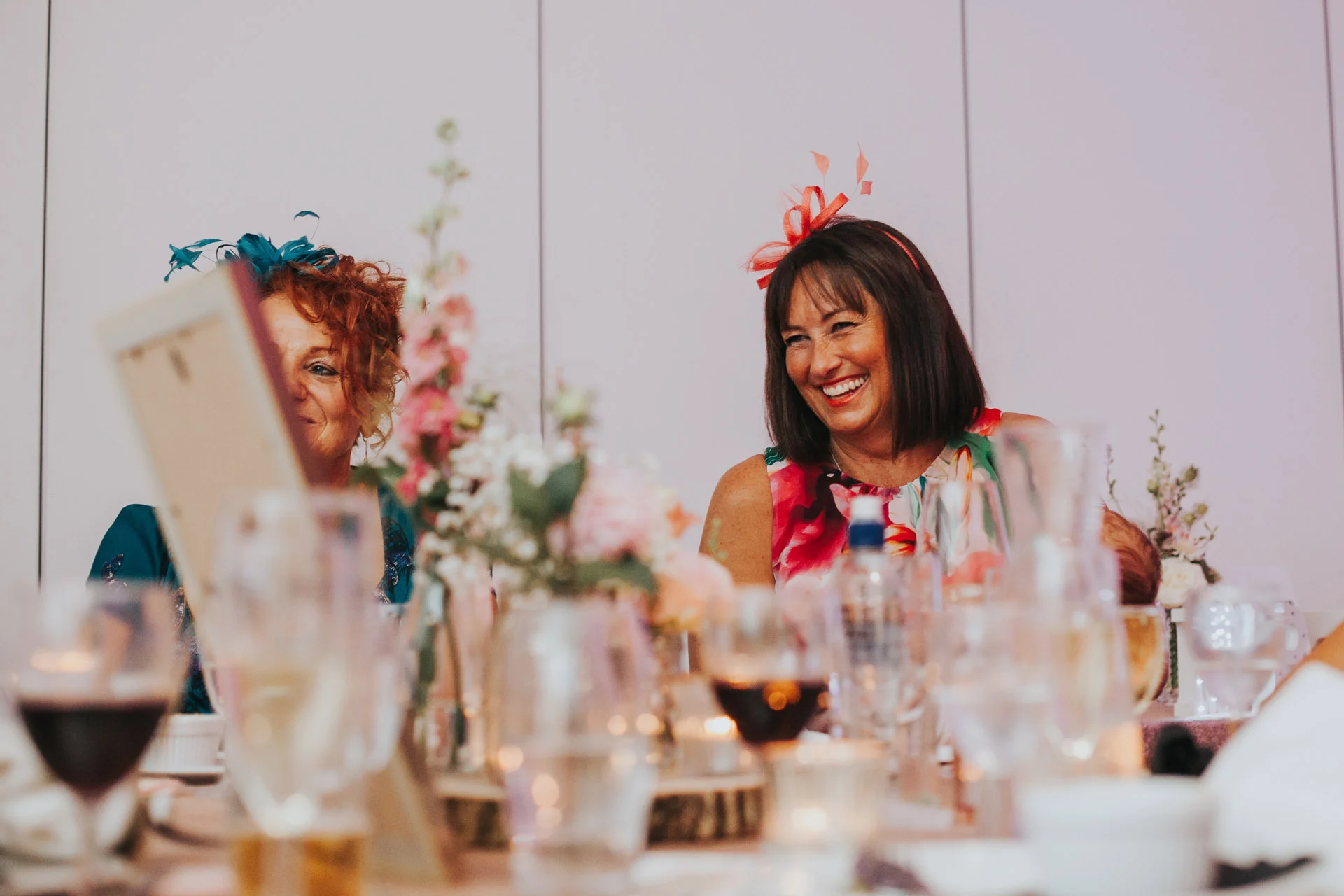 Wedding guests laughing.