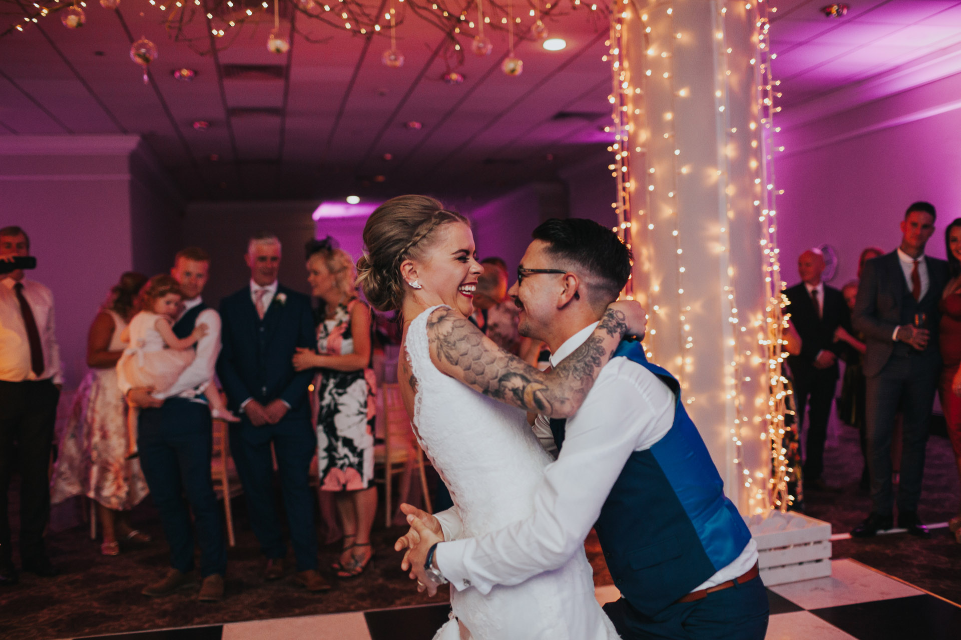 Photograph of bride and groom having their first dance together. 