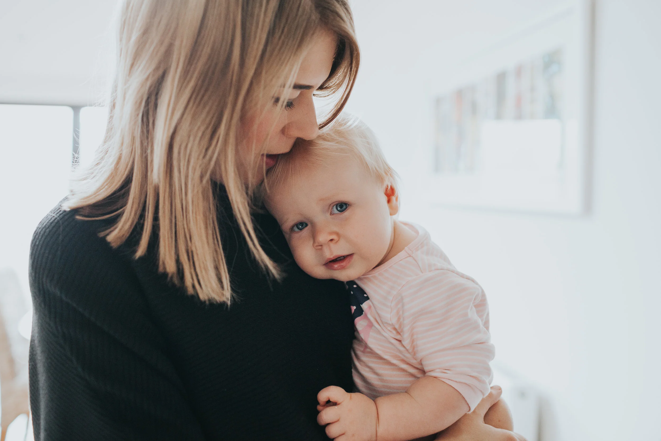 Evie's mother gives her a kiss