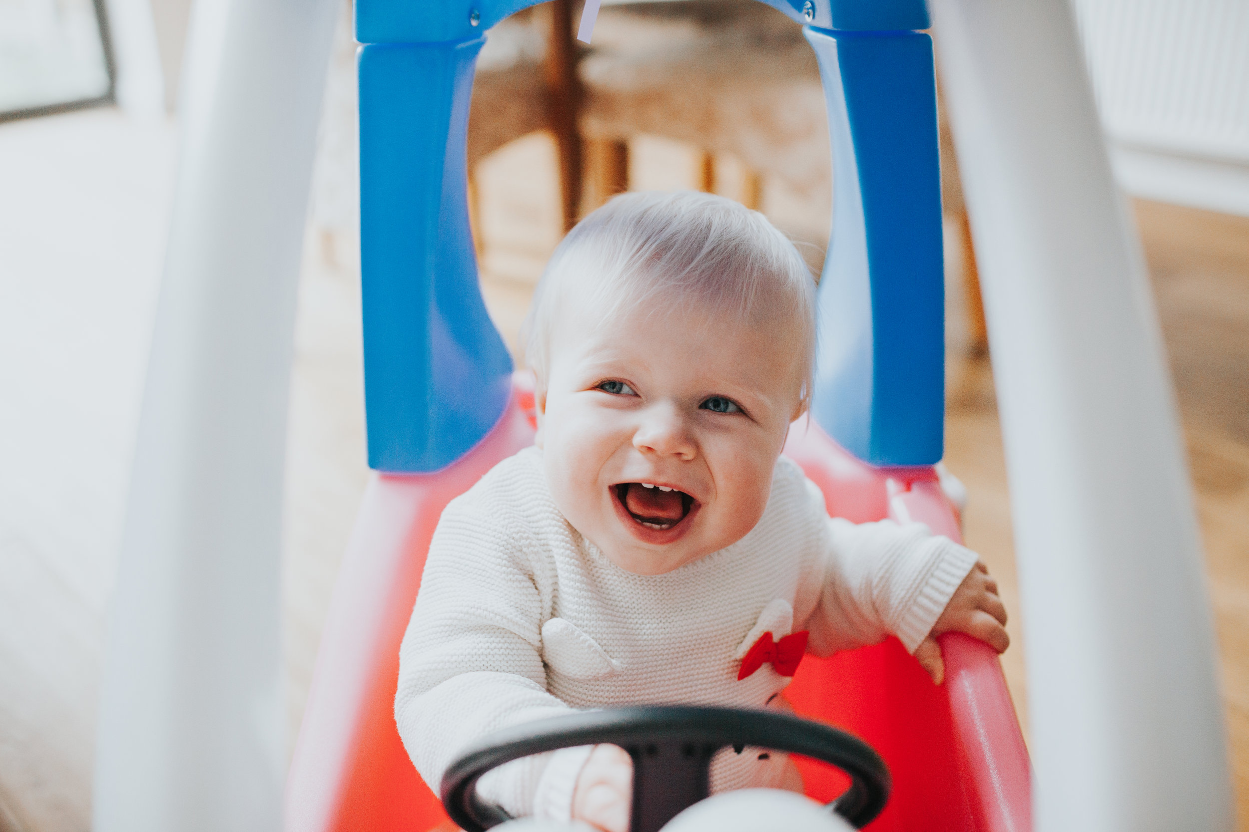 Evie drives her new car. 