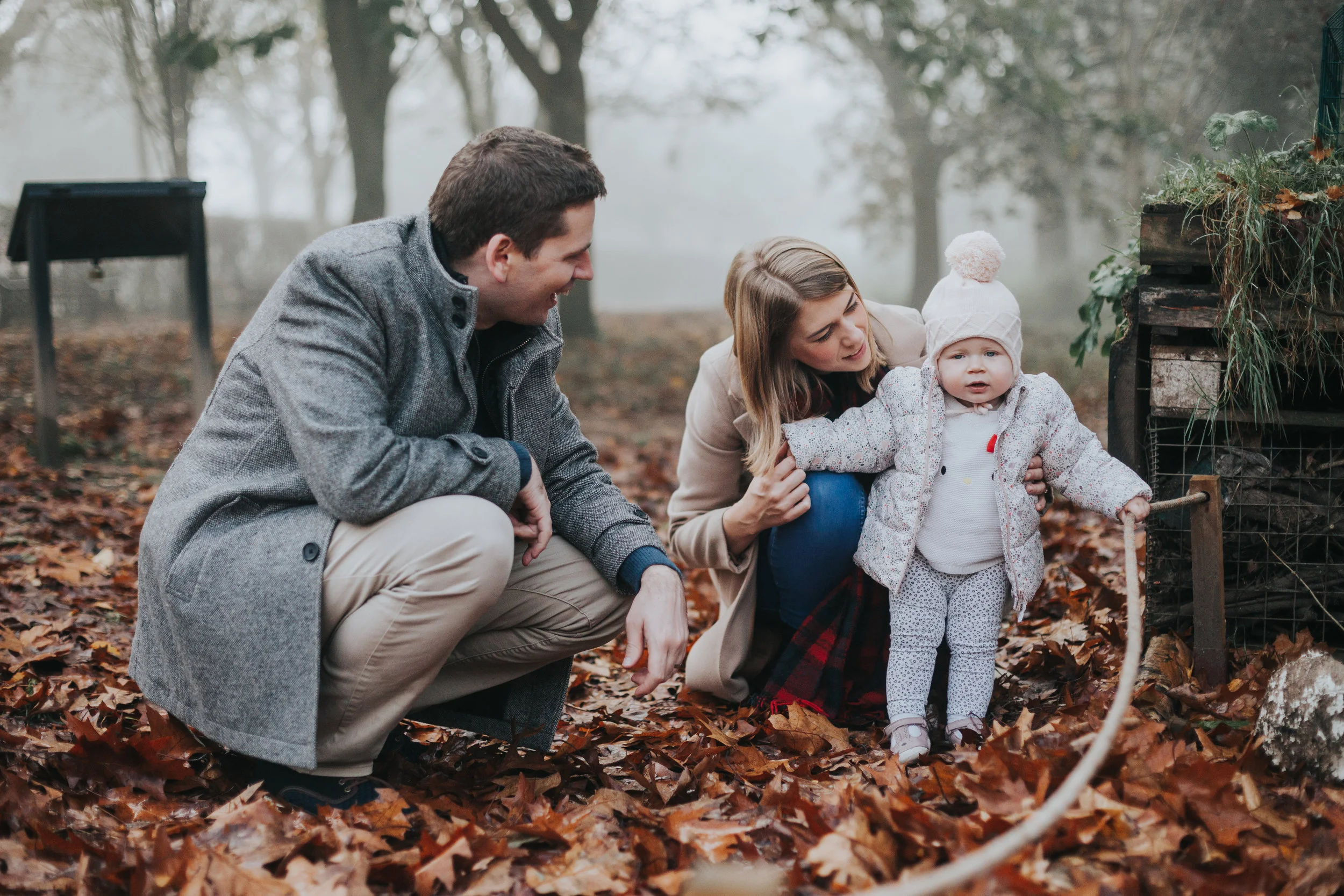 Evie with Mum and Dad in Park.