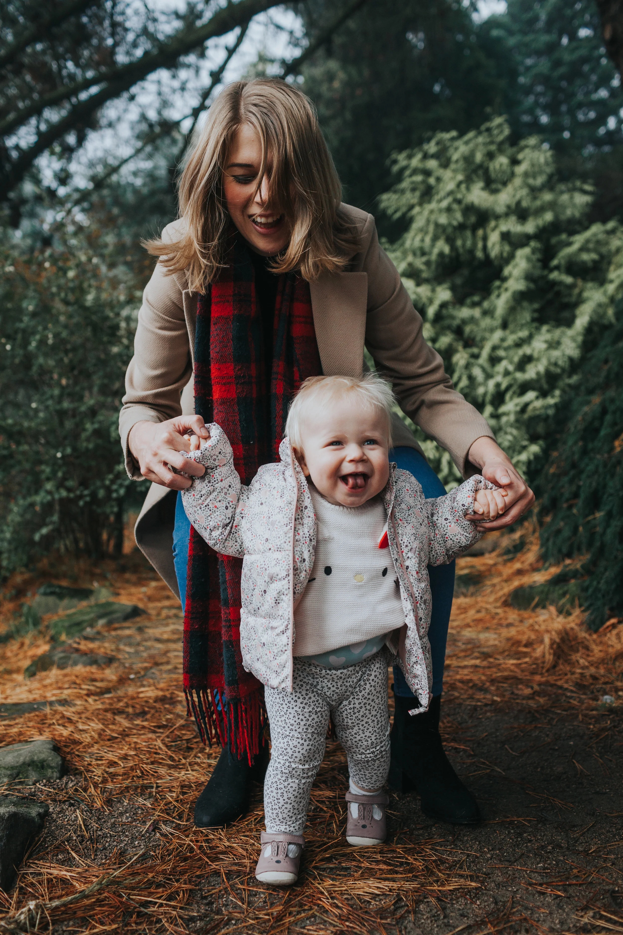 Mum and Evie laugh and Evie walks.