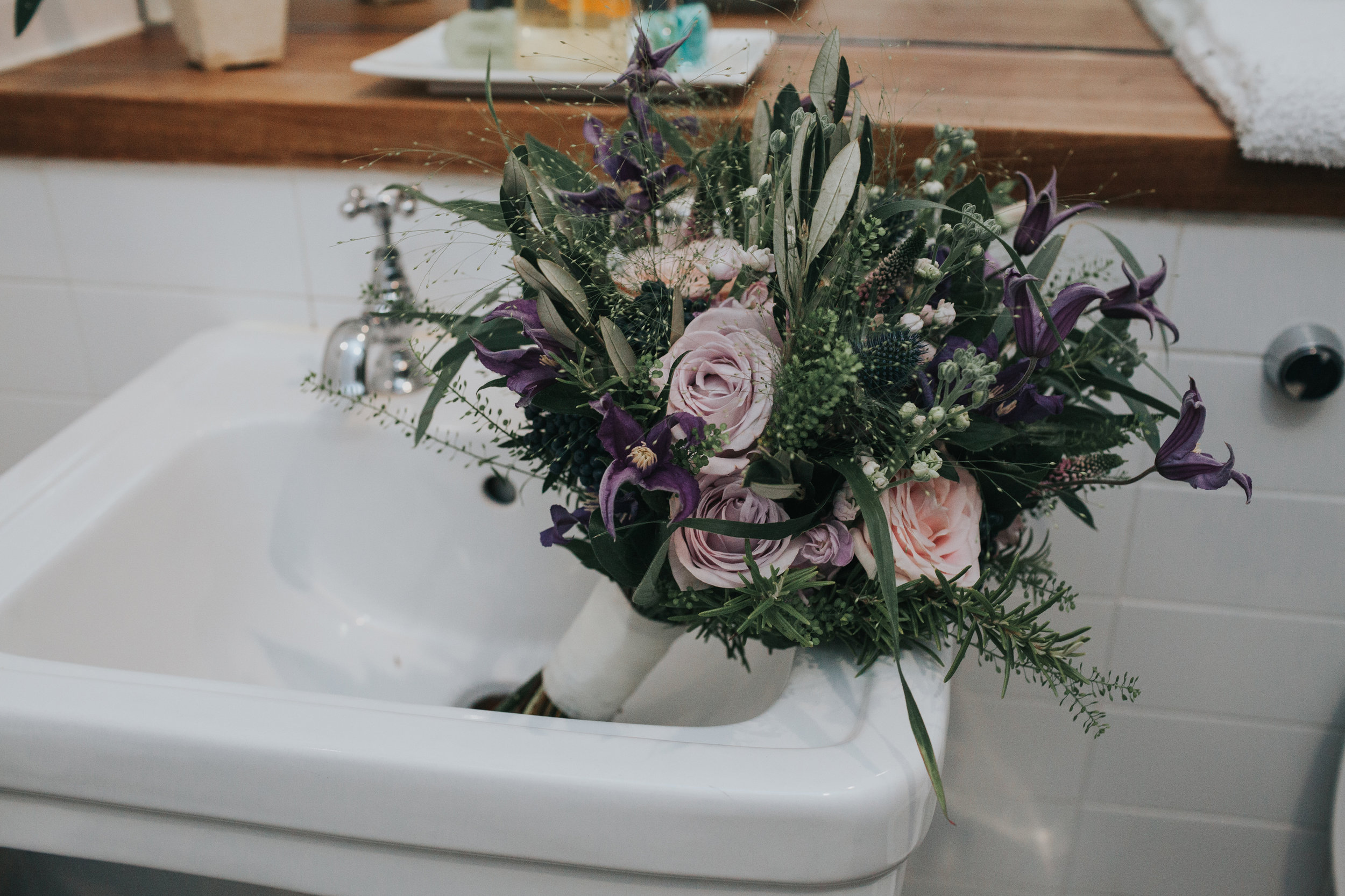 Flowers in sink of hotel room in The Racquet Club Liverpool.