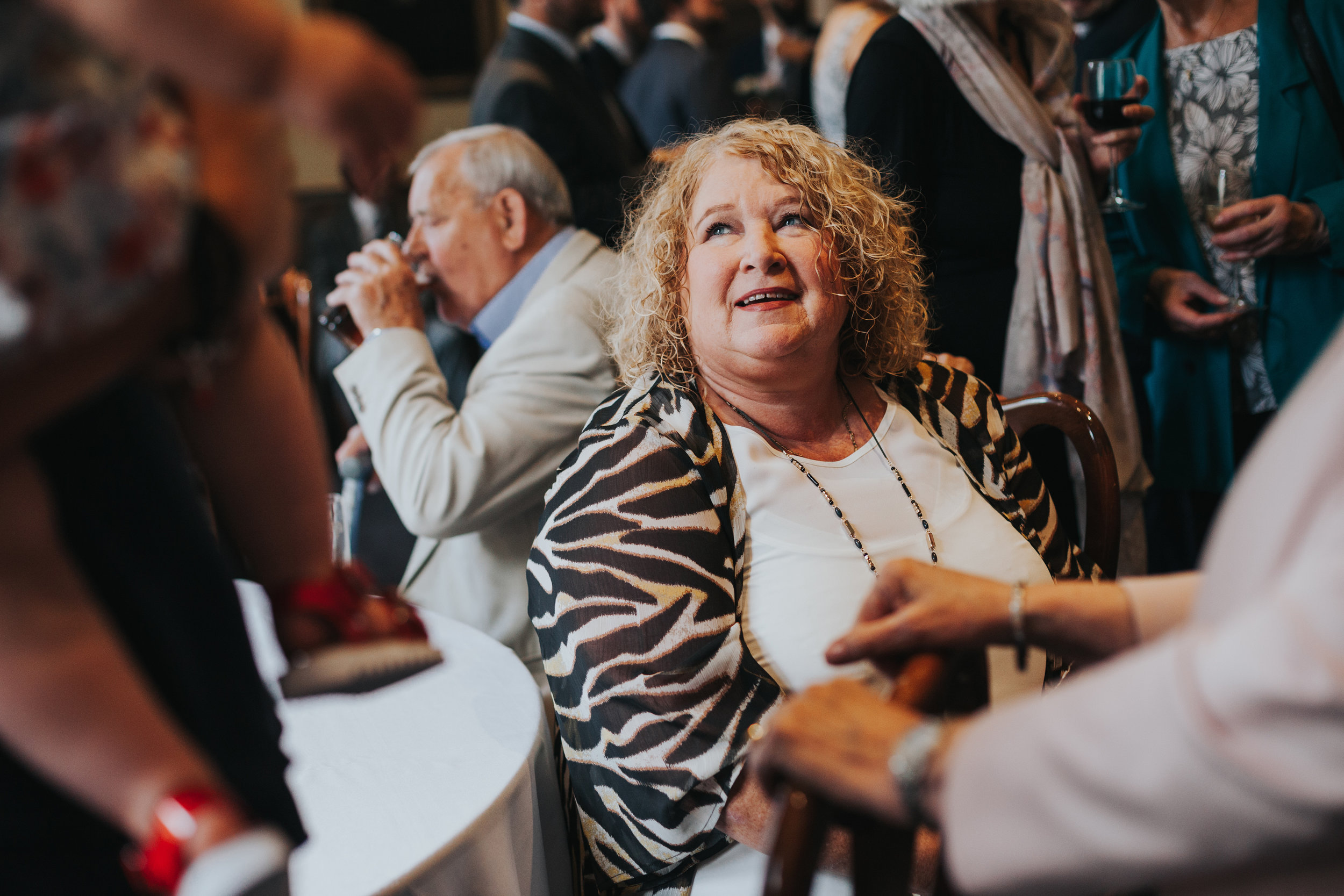 Wedding guest smiling. 