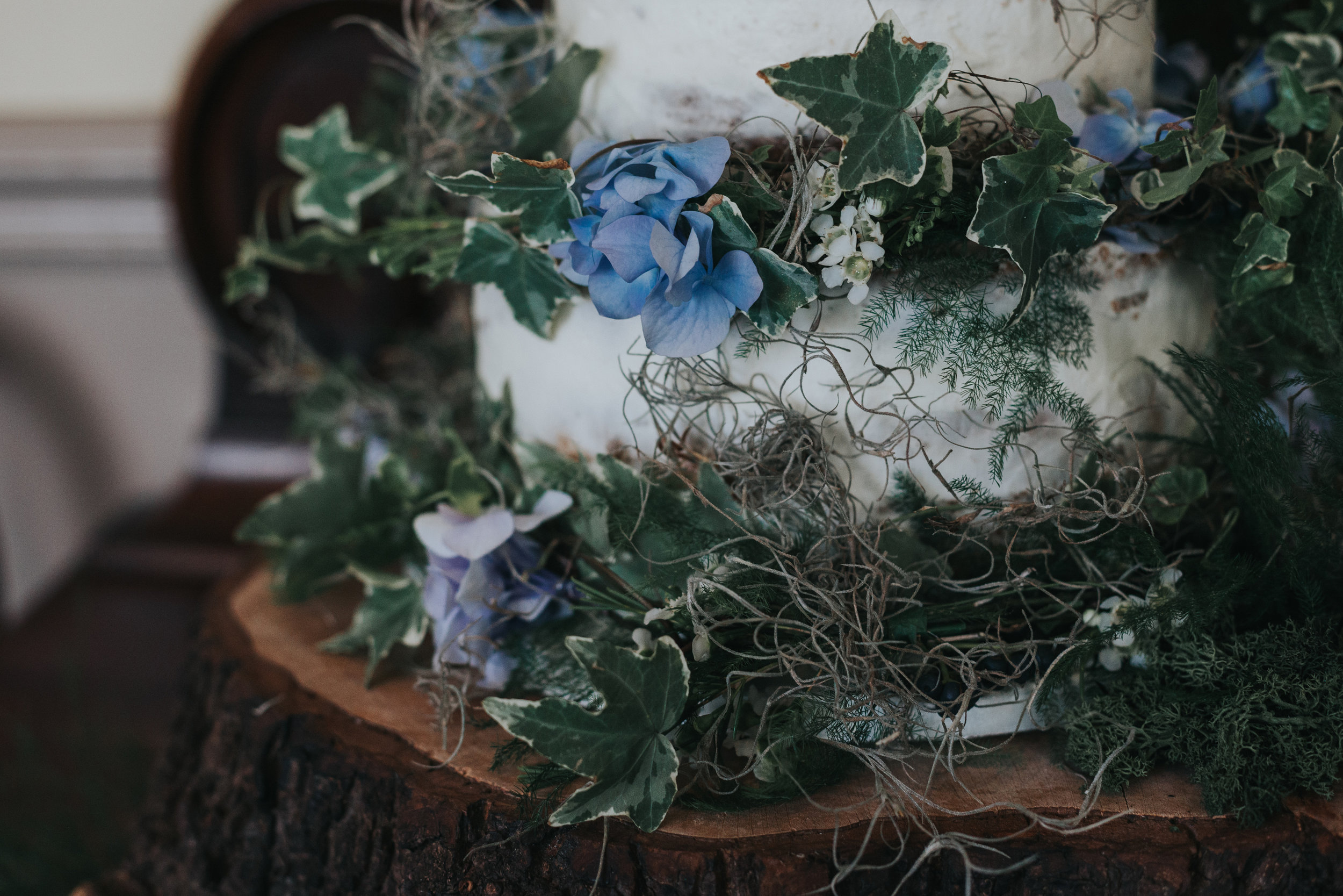 Flowers on the base of the wedding cake.