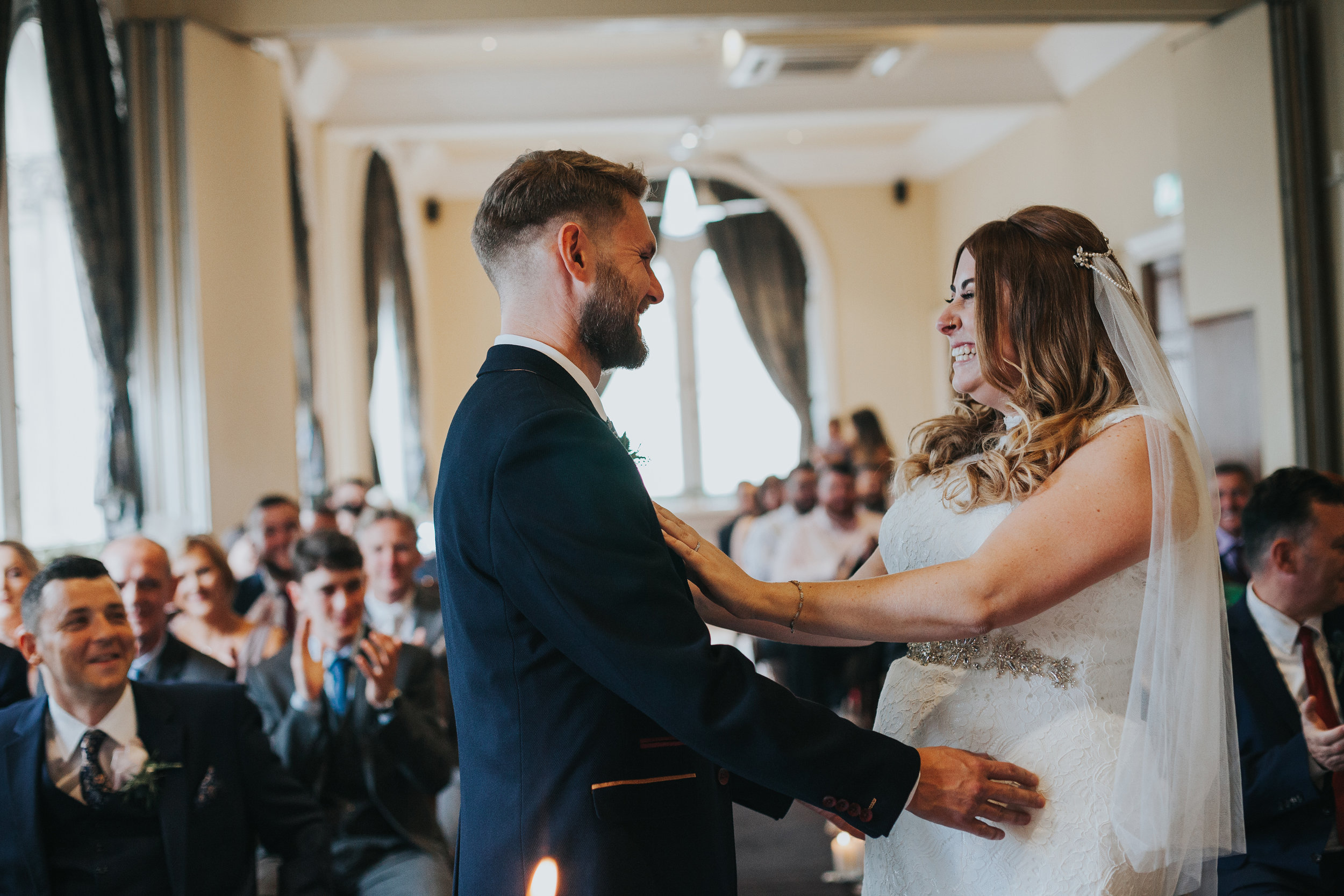 Bride and Groom holding each other. 