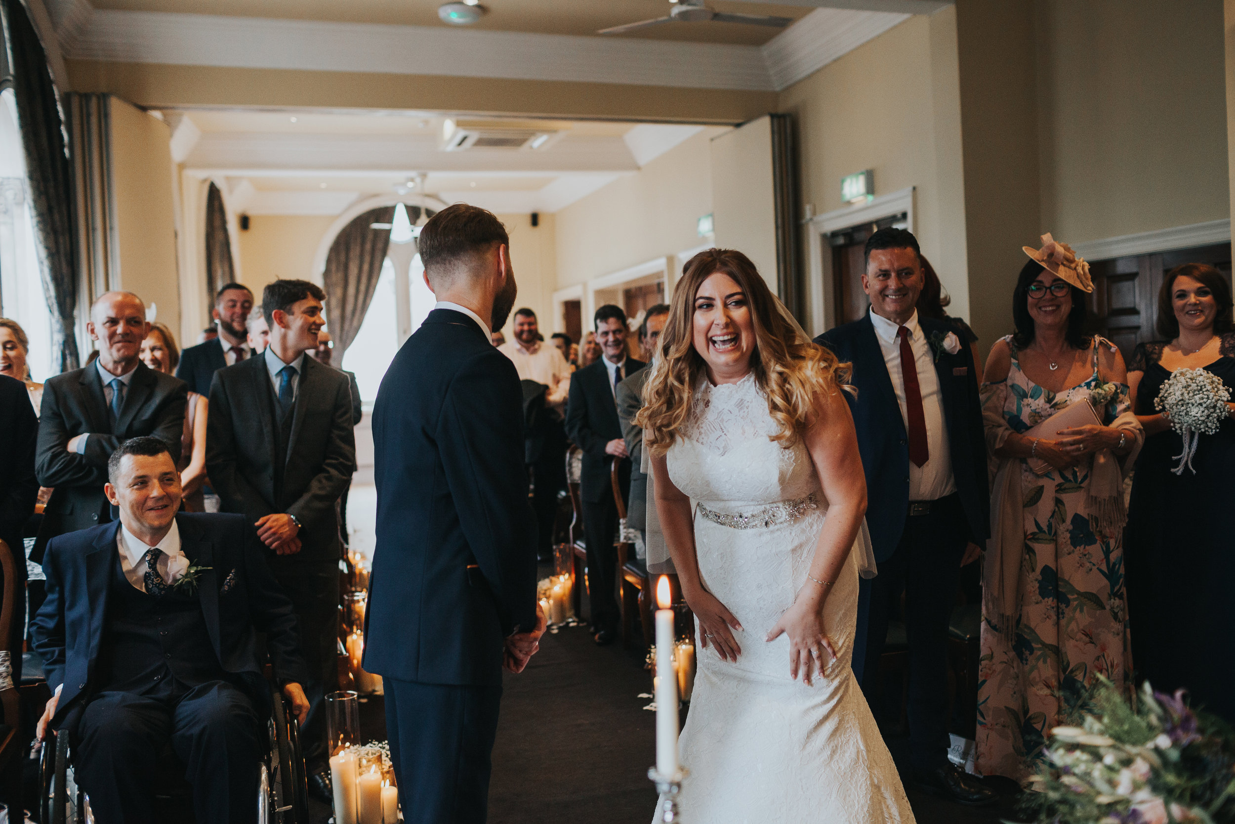 Bride and groom laughing.