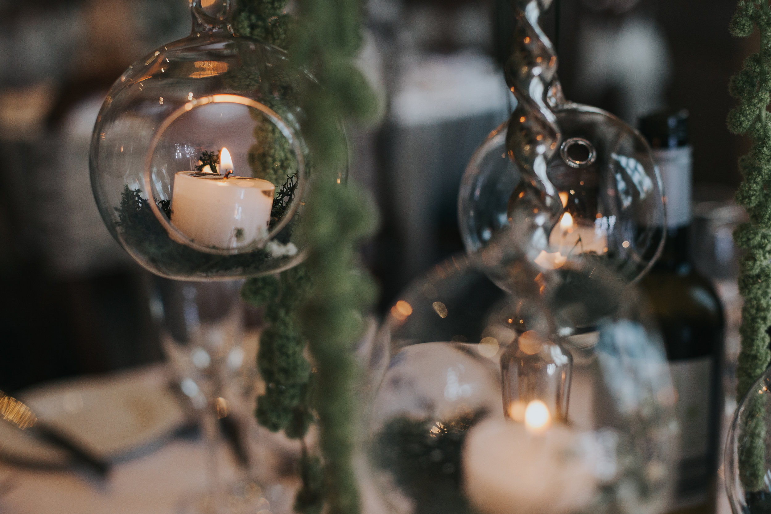 Candles in glass domes.