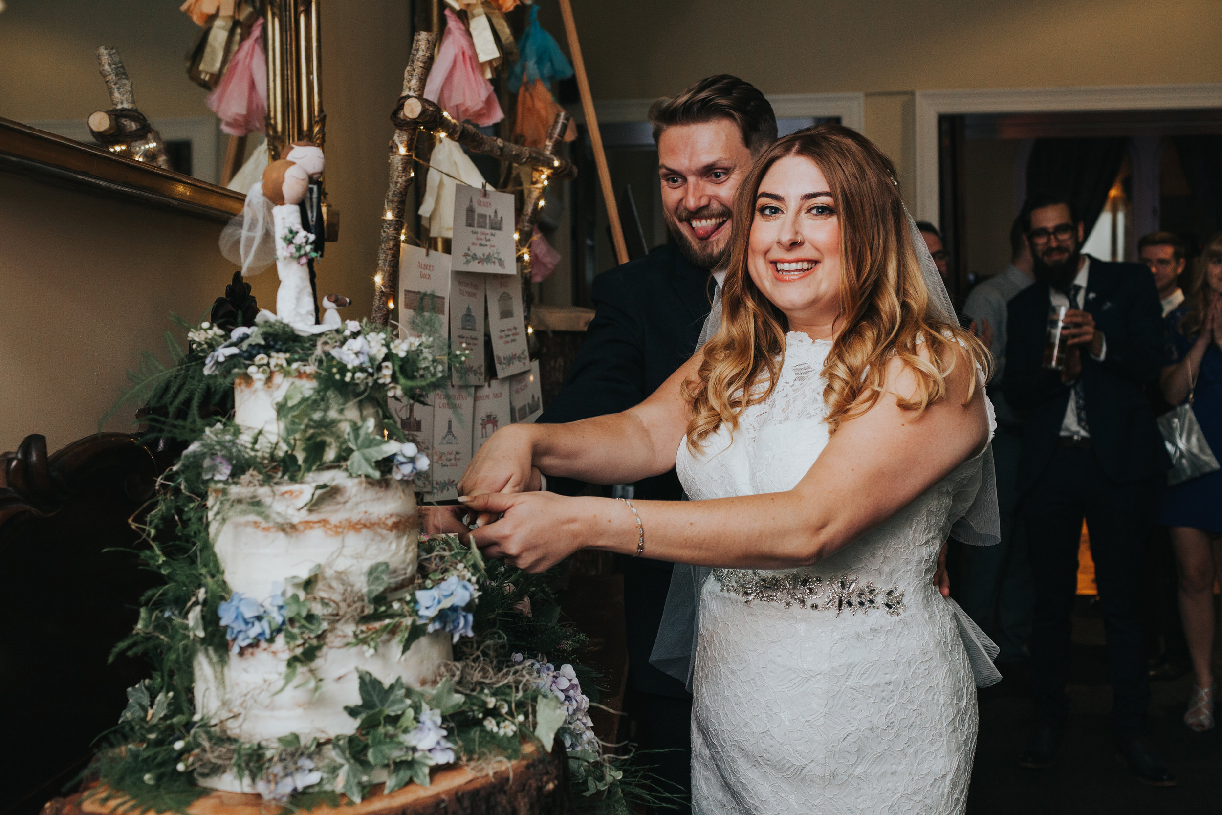 Bride and Groom Cut Wedding Cake.
