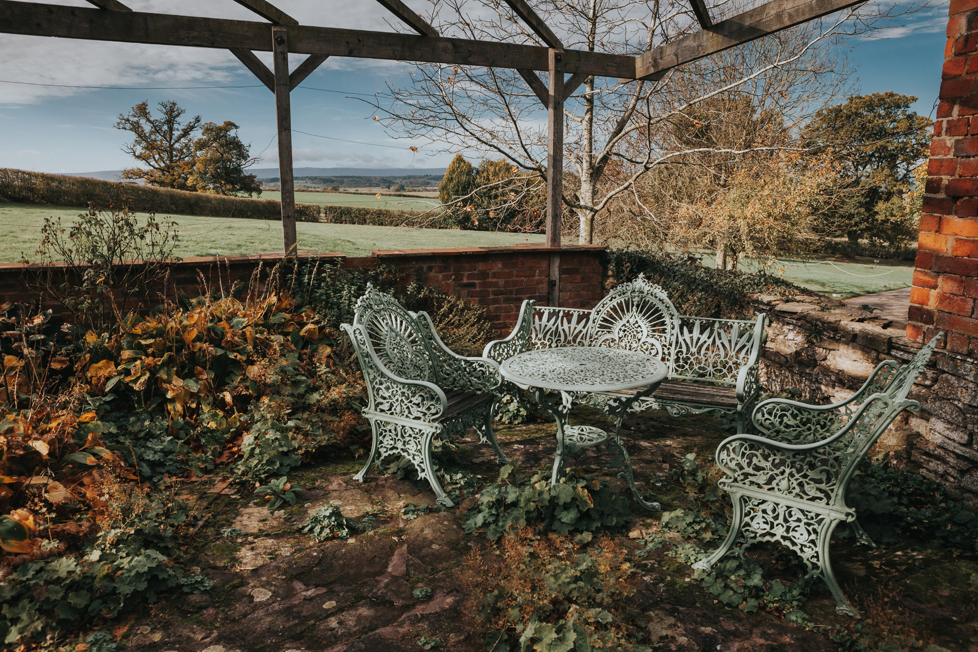 A table and chairs outdoors at Dewsall Court, Callow