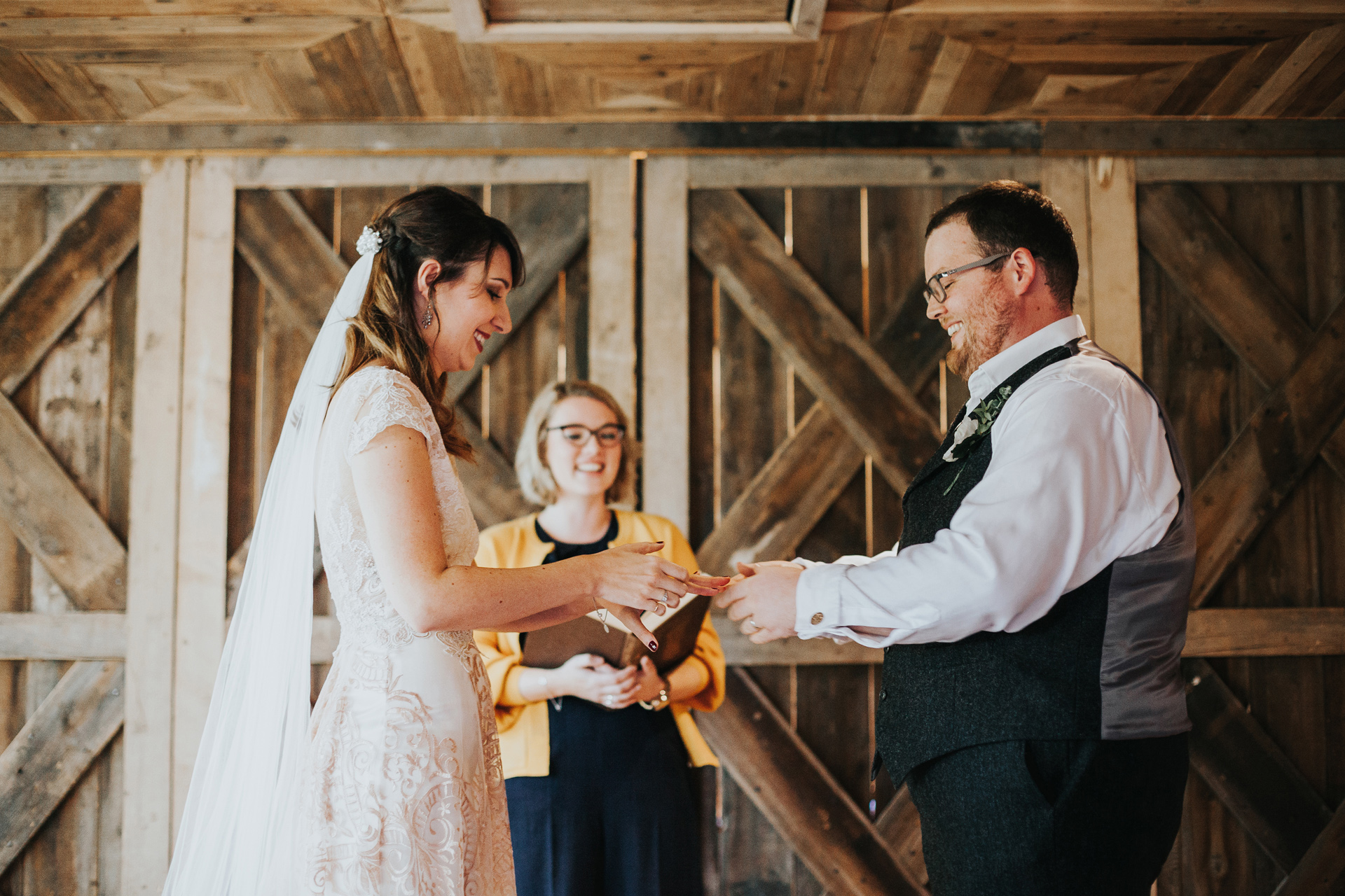 The bride and groom exchange rings at Deswall Court.