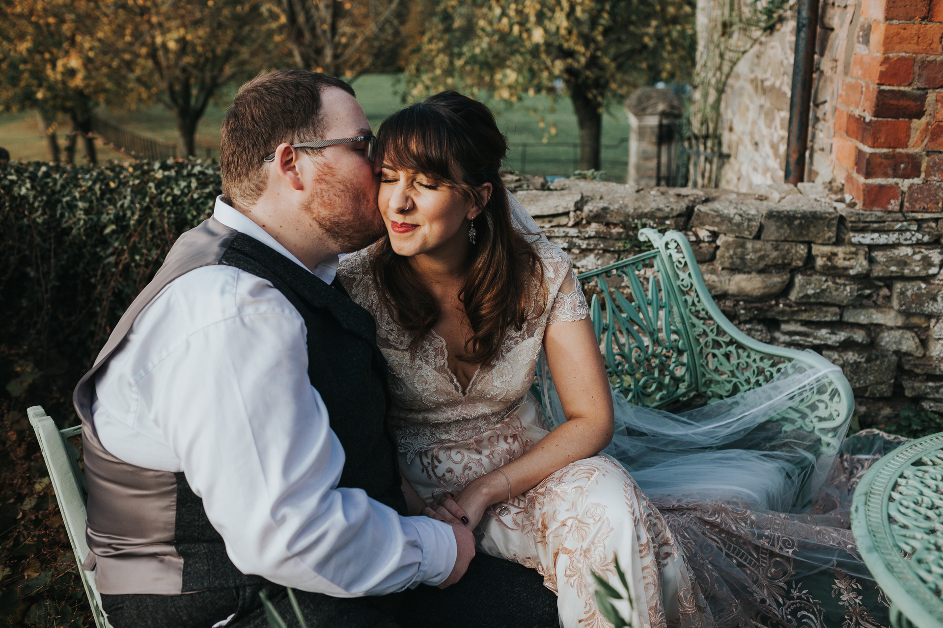 Bride and Groom sitting together at Dewsall Court. 