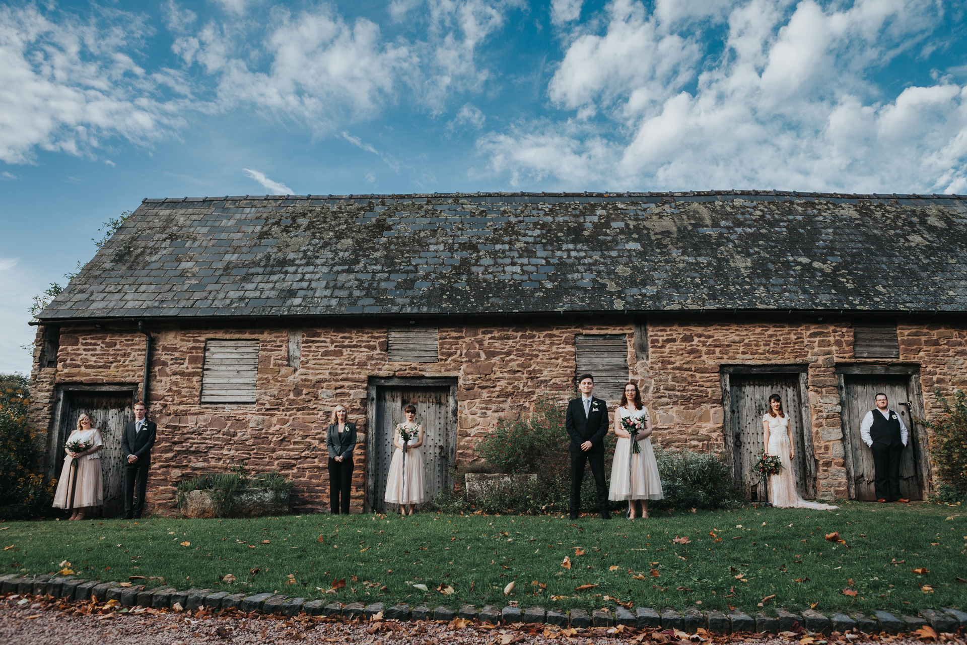 Bridal Party Photo at outside stables at Dewsall Court.