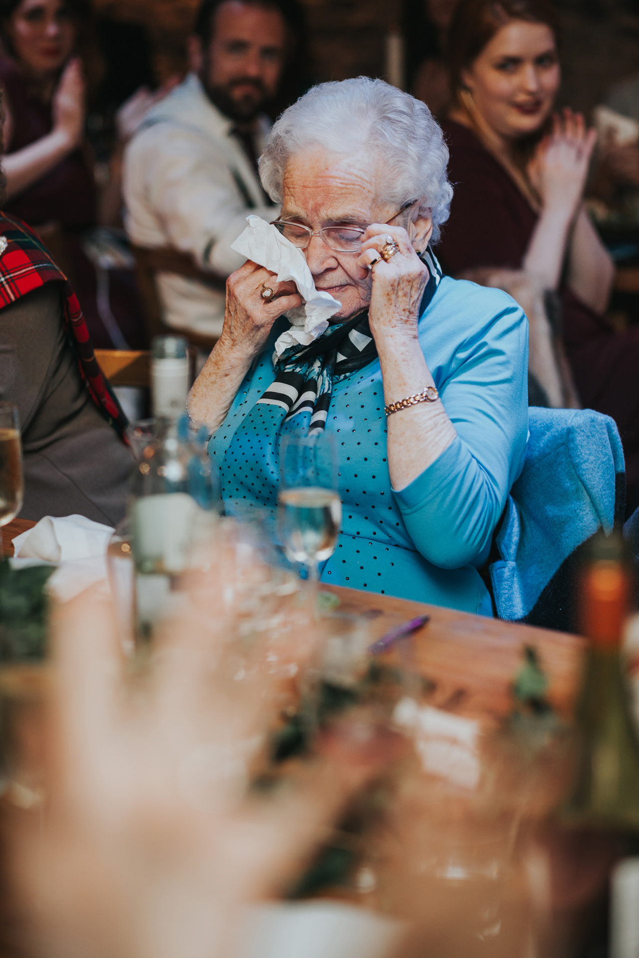 Grandma wipes her tears.