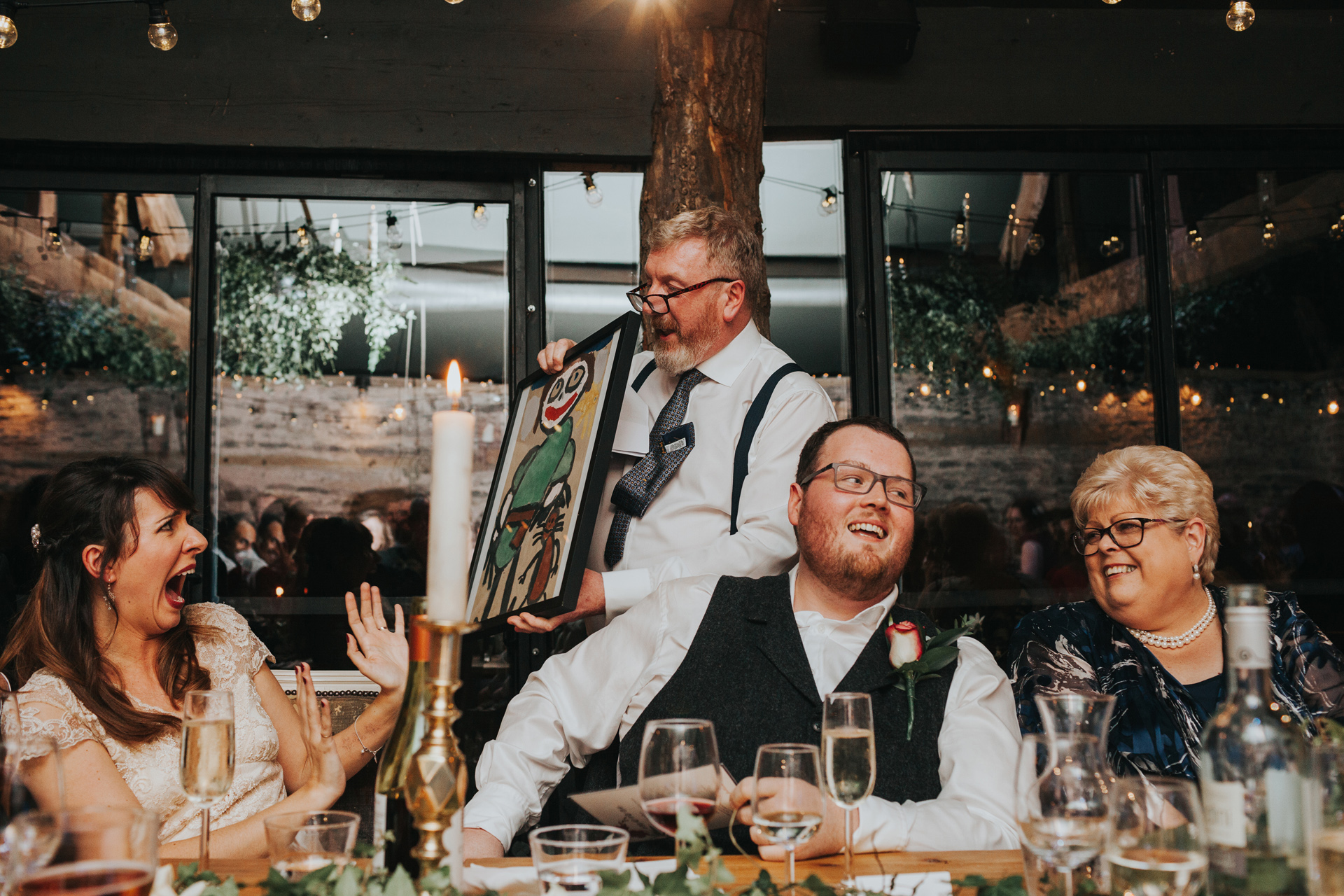 Bride looks scared of wedding present.