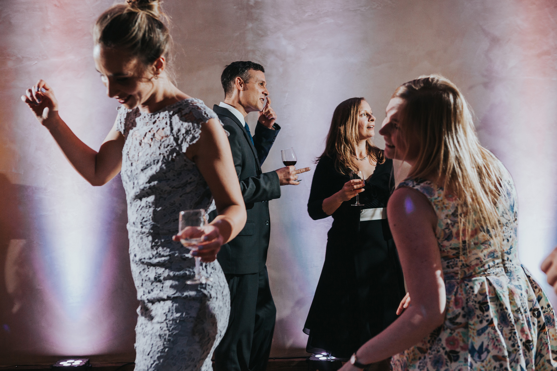 Dancing guests framing dancing guests. 