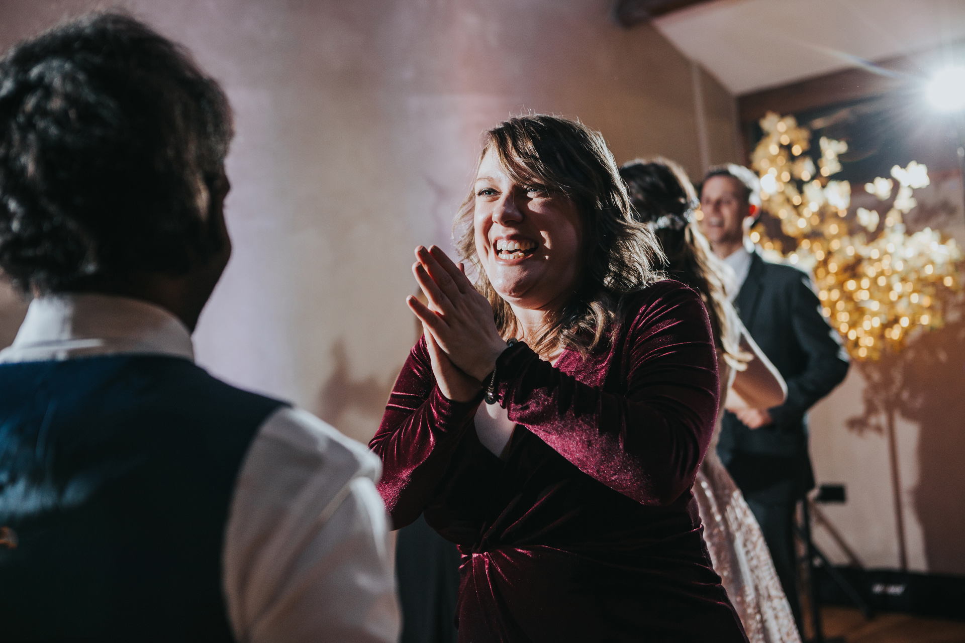 Guests smiling on dance floor. 