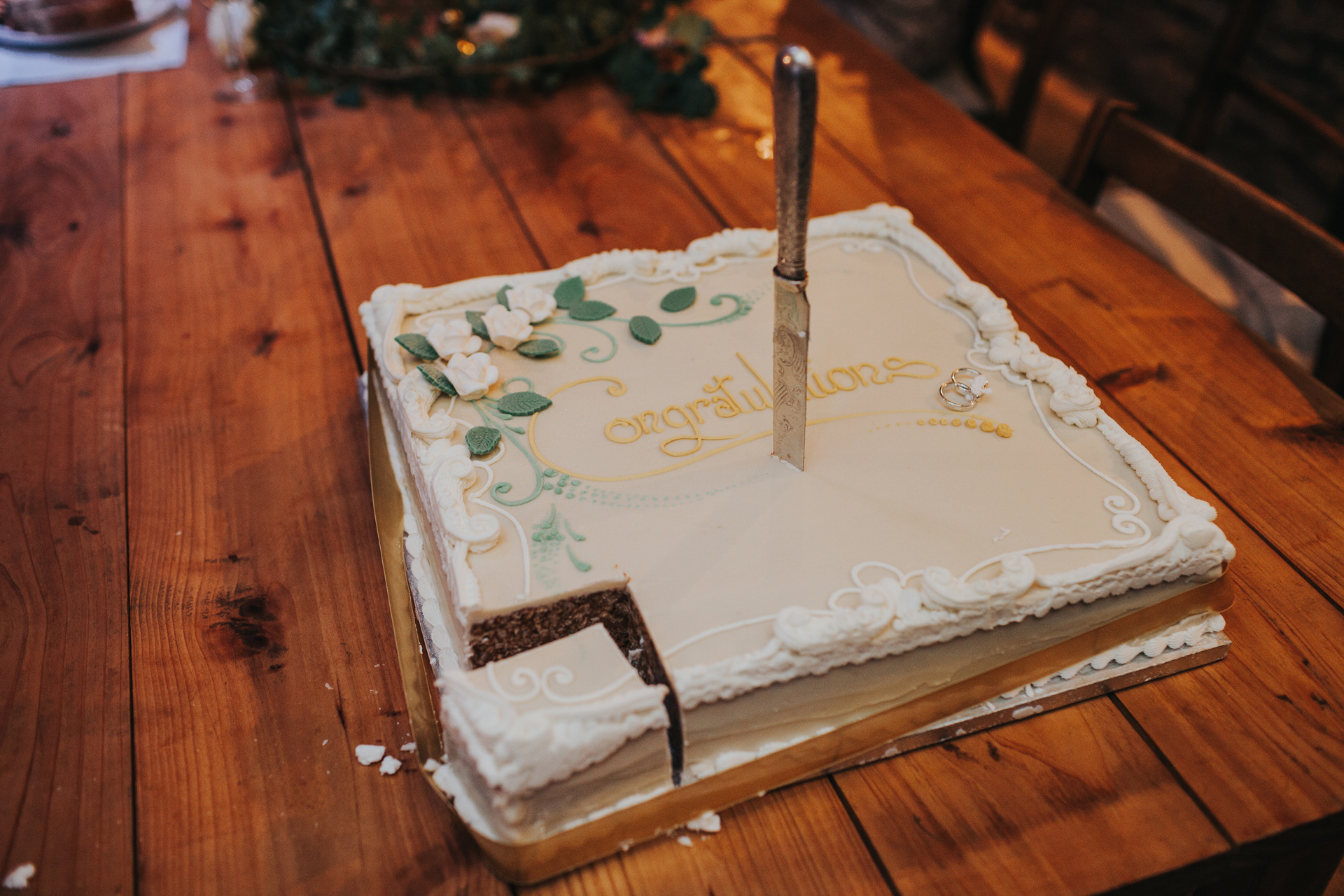 Knife sticking out of cake. 