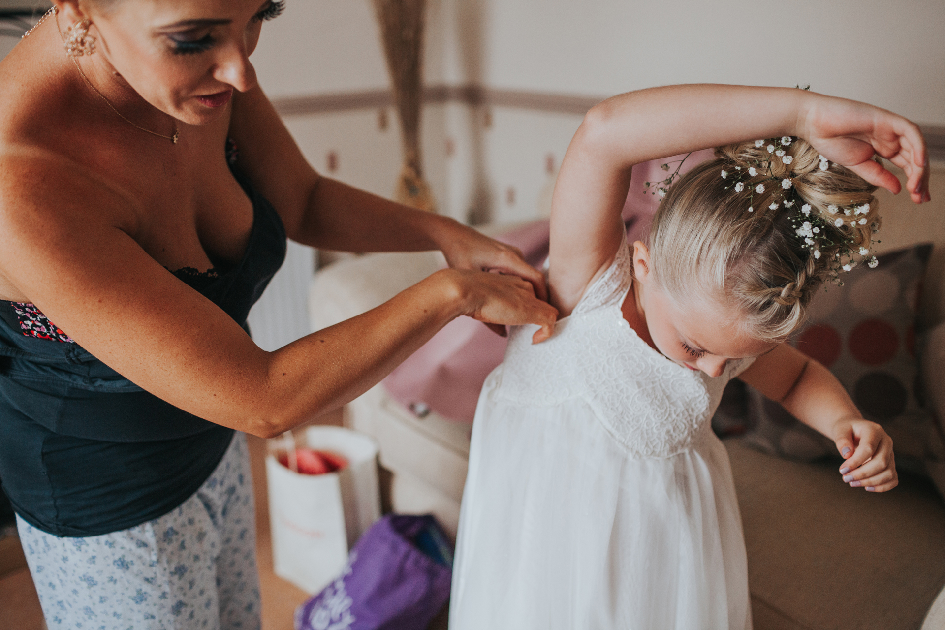 Flower girl getting her dress on. Liverpool. 