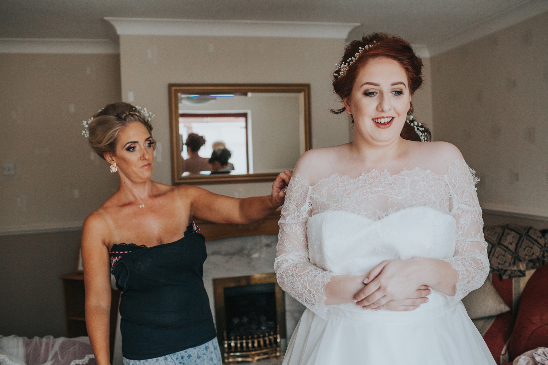 Bride getting her dress on in Liverpool. 