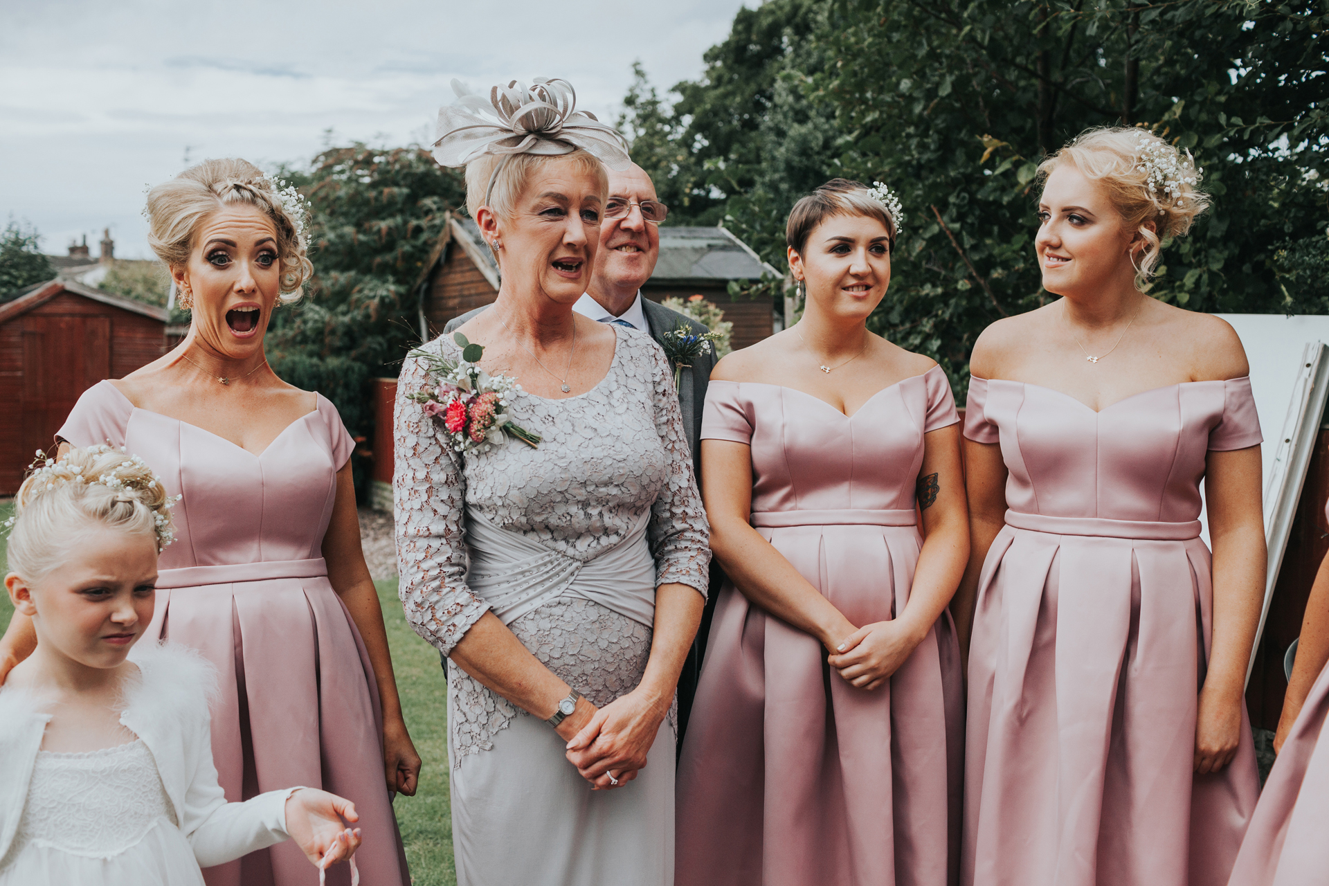 Brides mum and bridesmaids react to her wearing the dress. 
