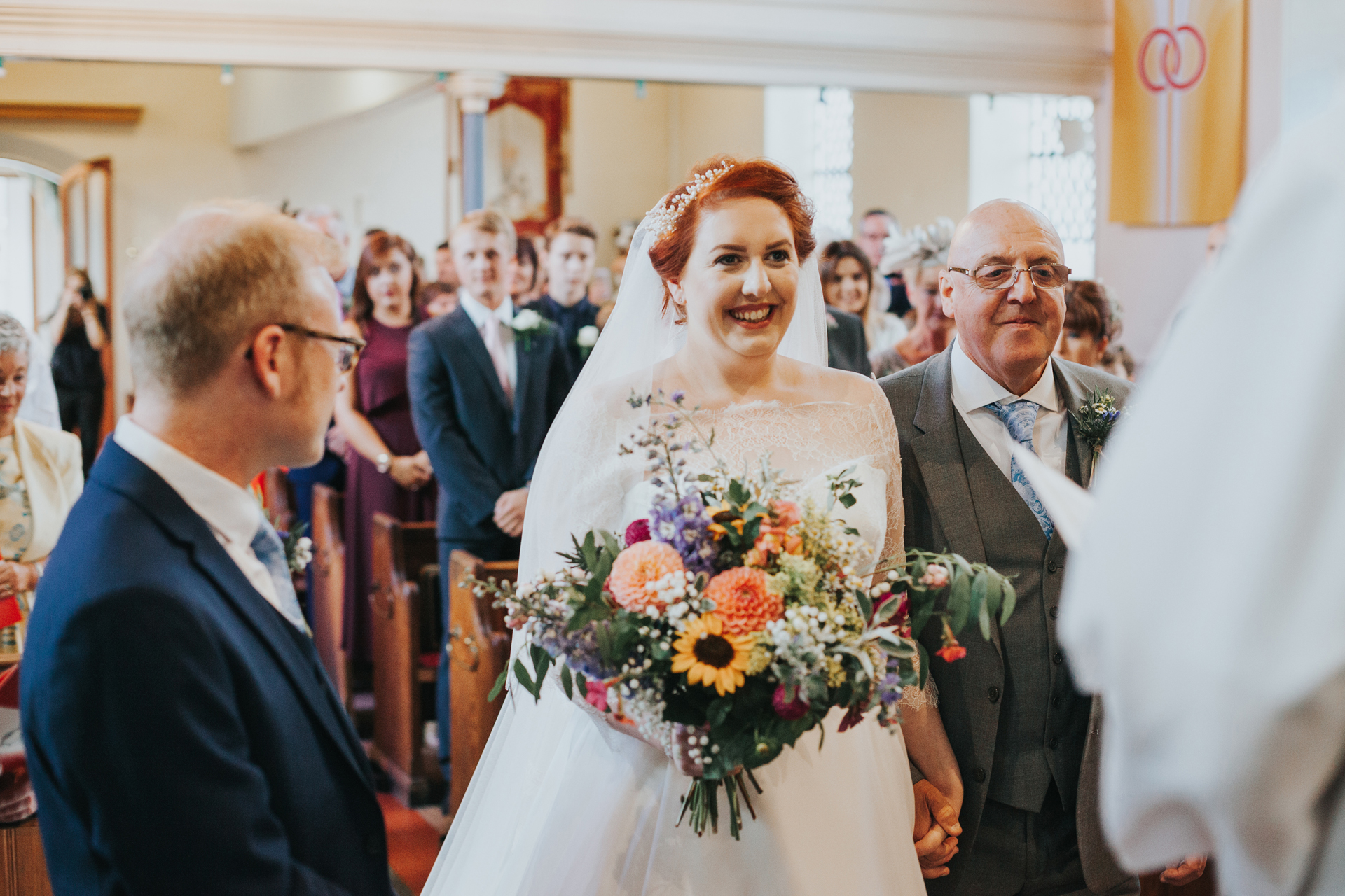 Bride arrives at the end of the aisle. 