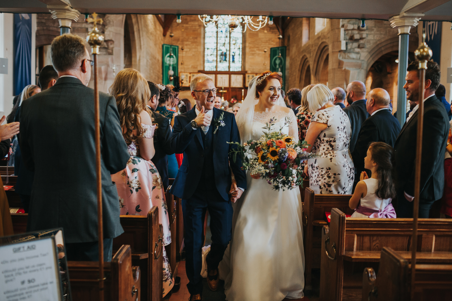Bride and groom make their way down the aisle at St Thomas's Church, Liverpool.