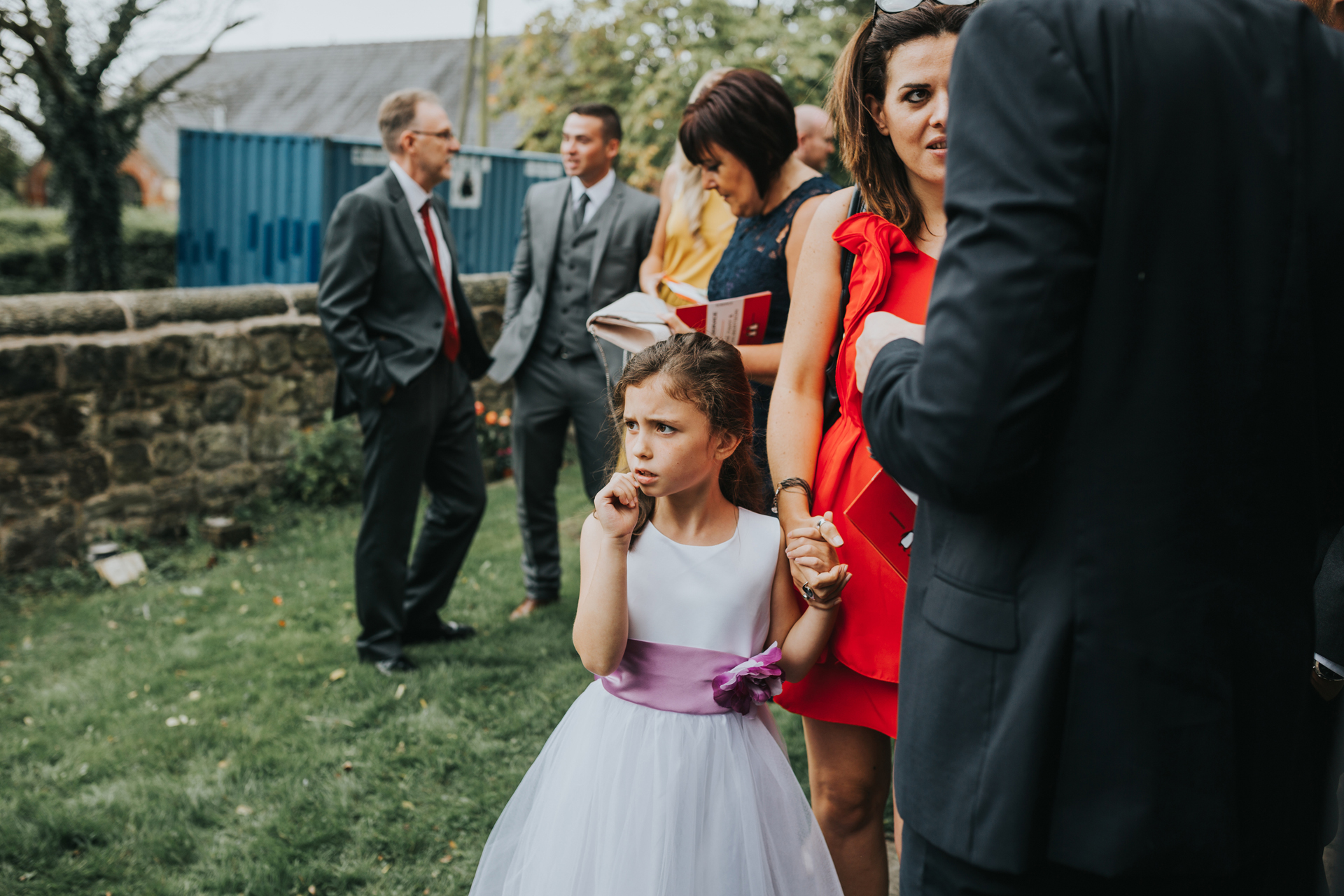 Little girl looks on at bride at St Thomas's Church Liverpool.
