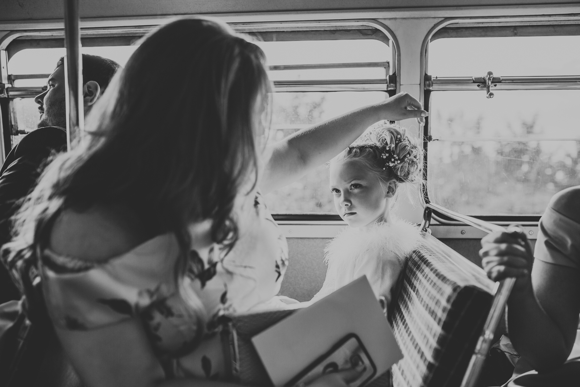 Flower girl looks angry. 