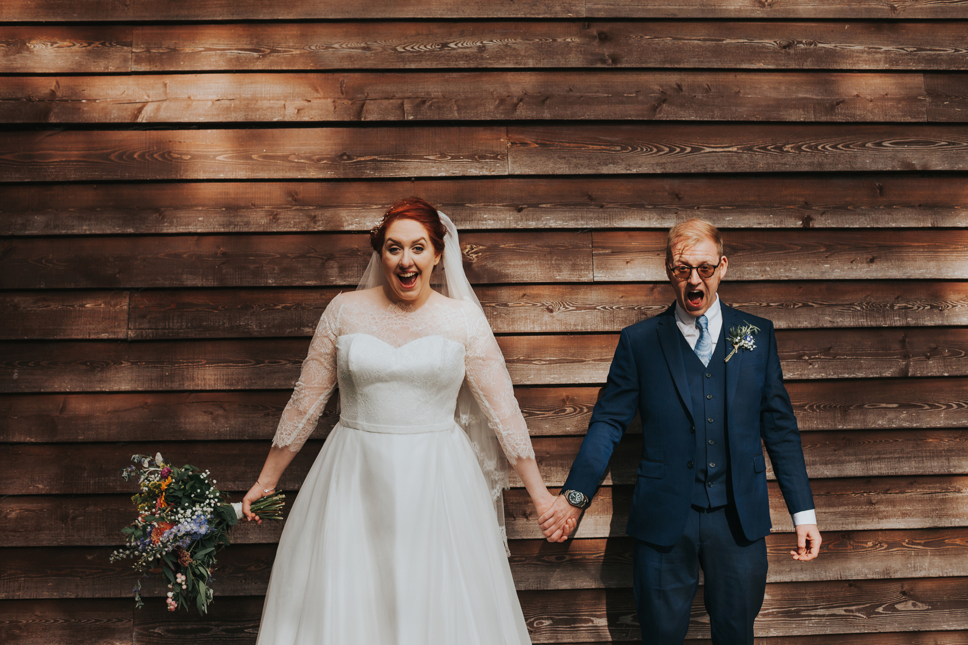 Bride and Groom have excited faces at Trafford Hall Wedding. 