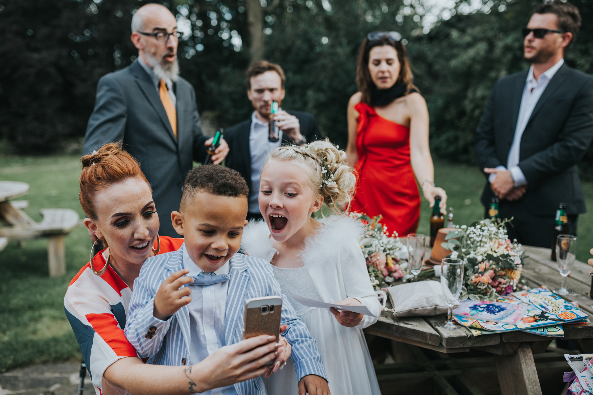 Children take a selfie in Trafford Hall Garden. 