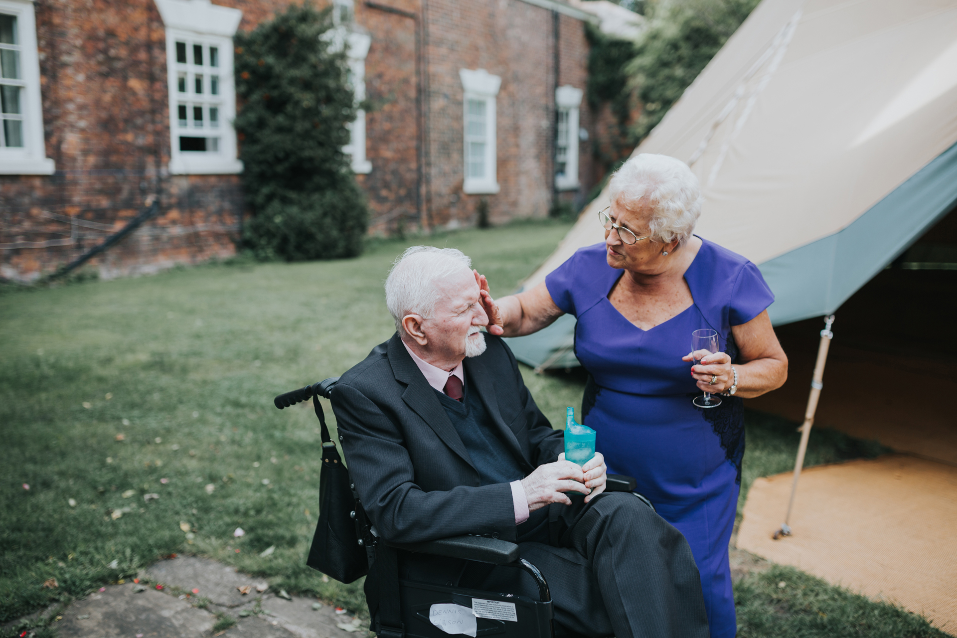 Couple share a moment outside the tipi.