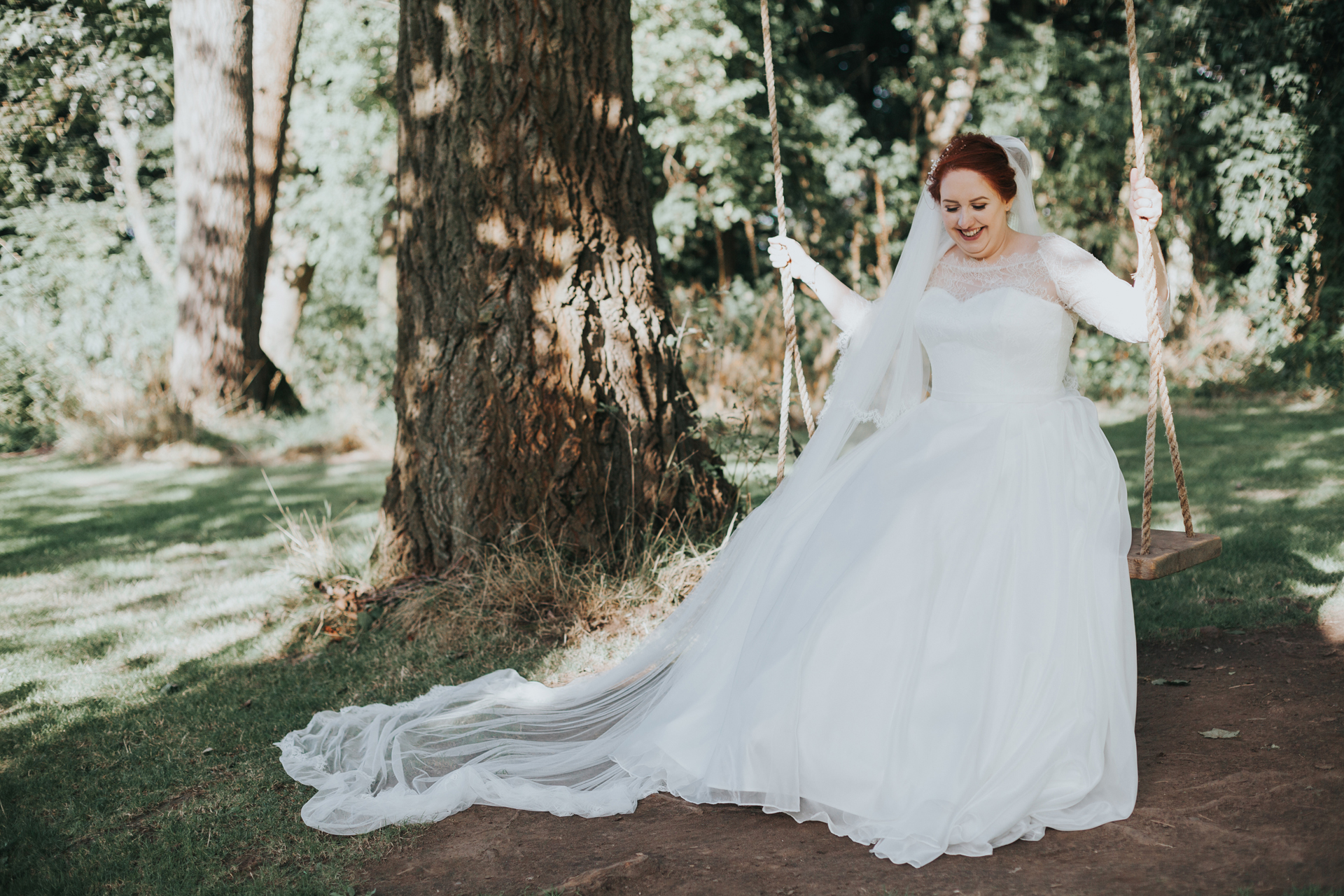 Bride on tree swing at Trafford Hall.