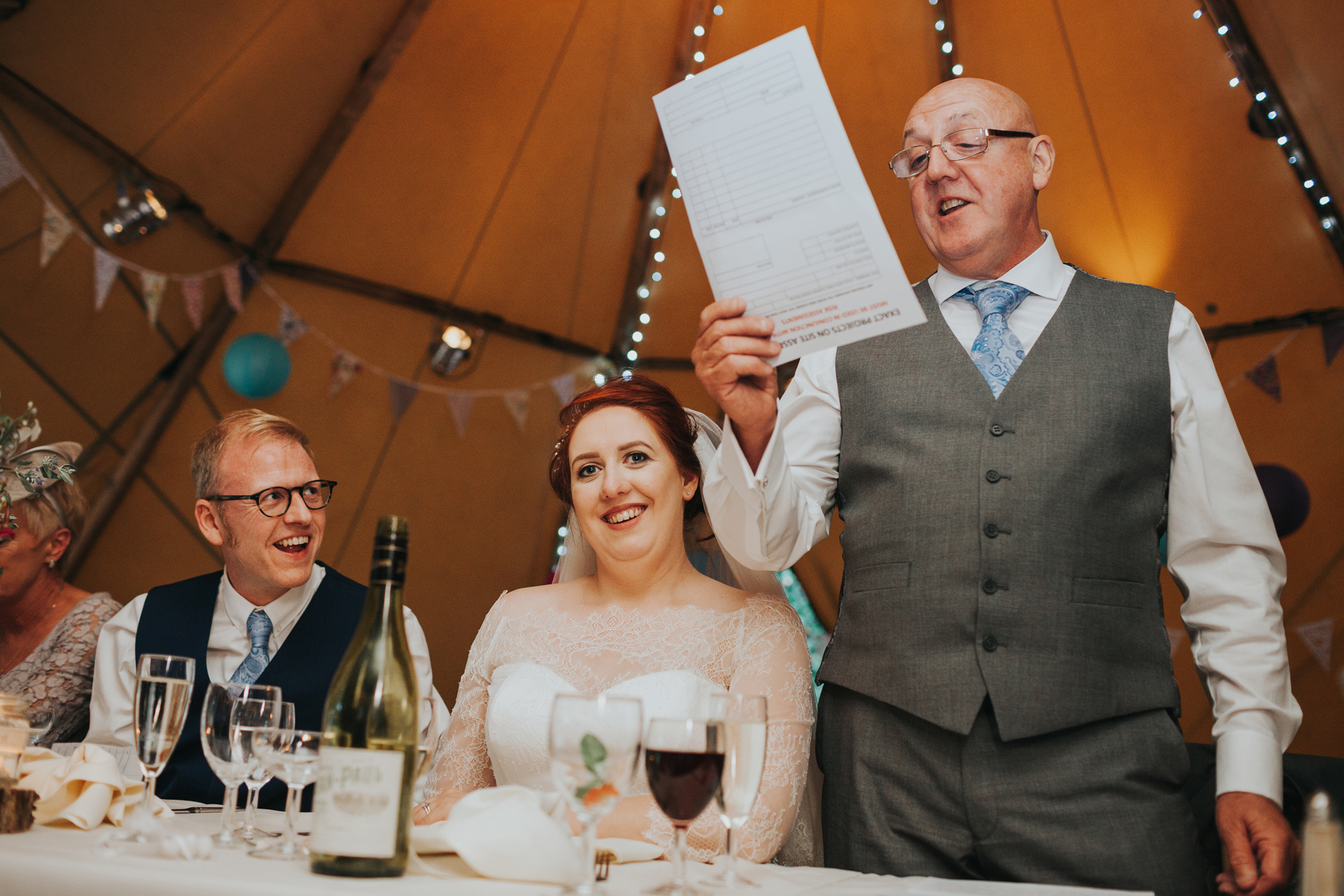 Father of the bride making his speech inside tipi. 