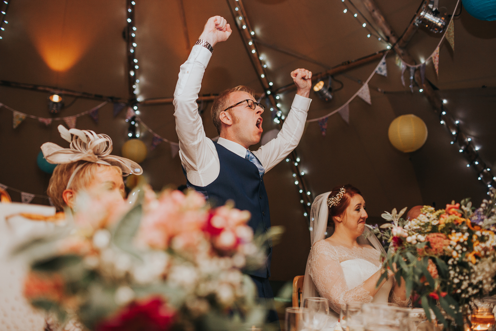 The groom cheering. 