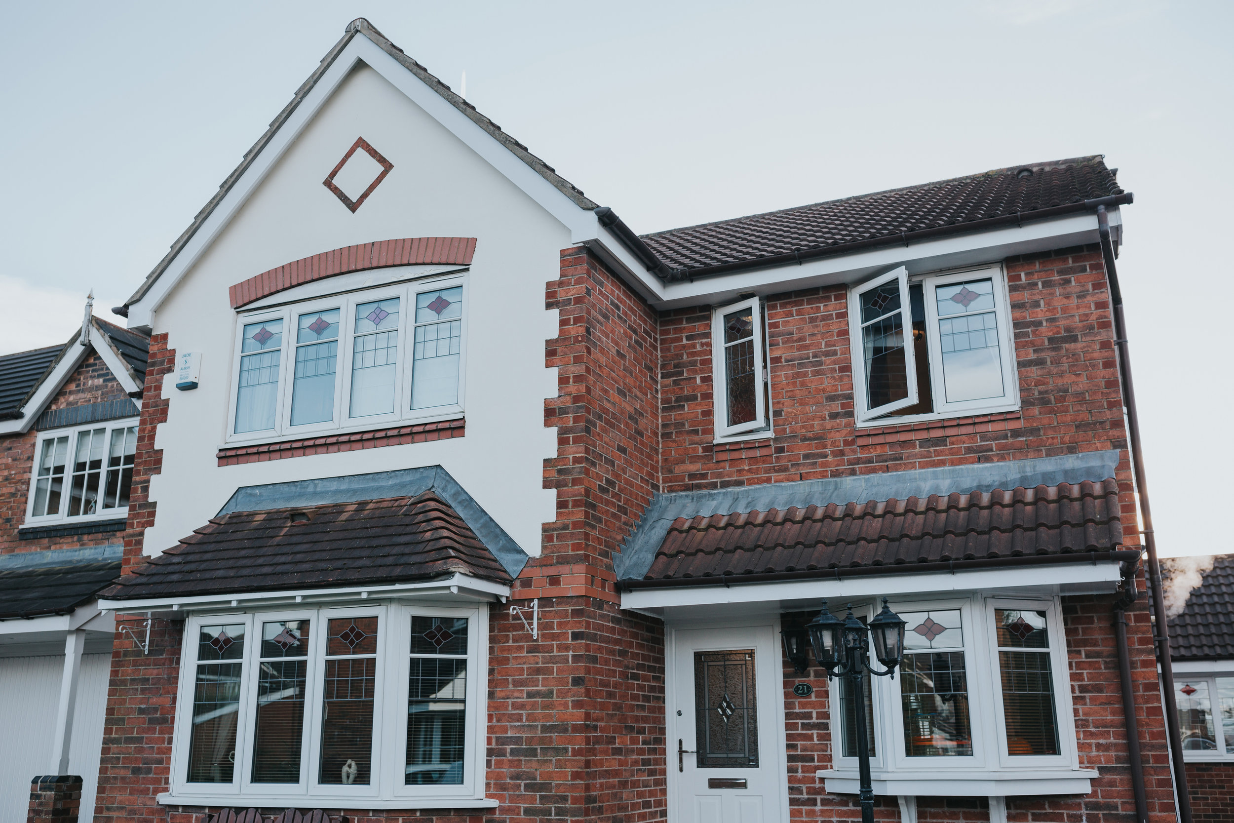 Exterior shot of the grooms family home. 