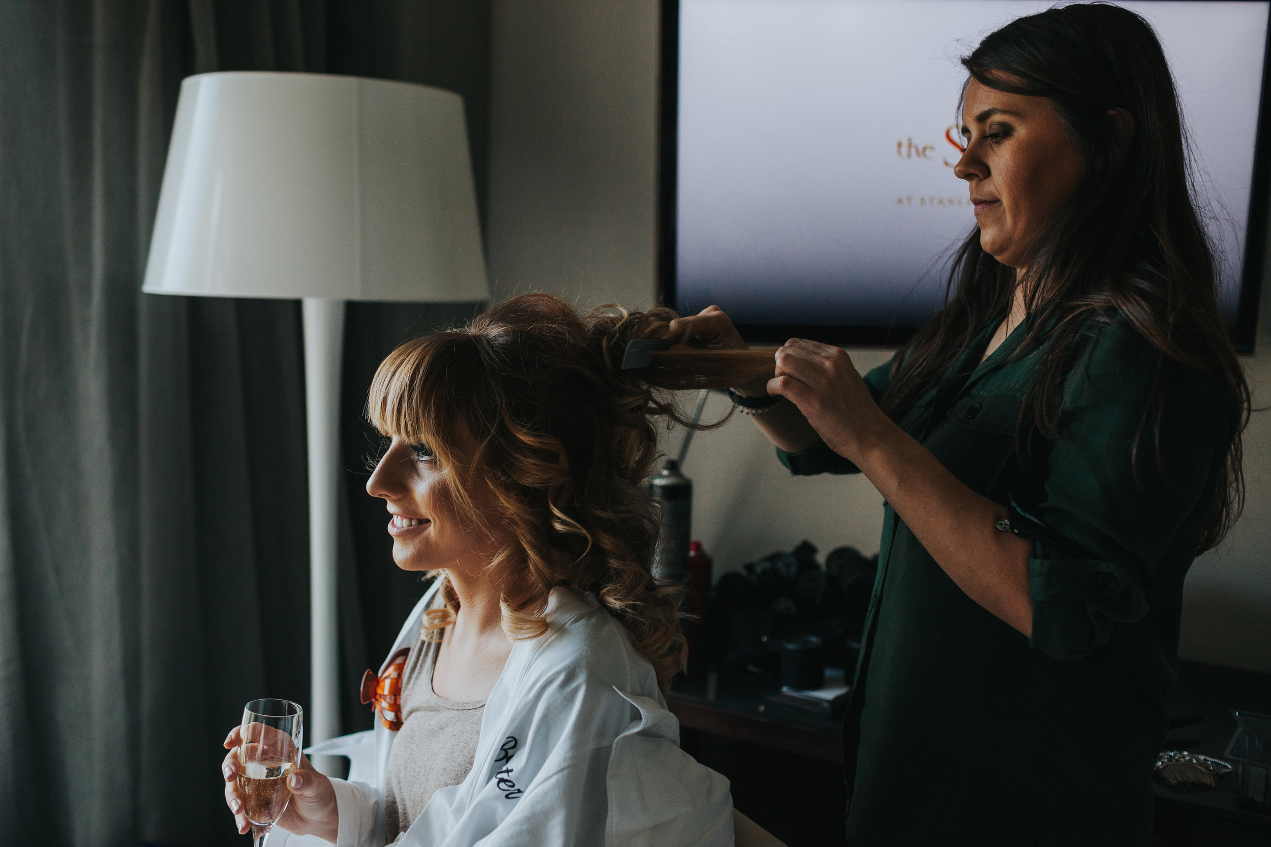 Bridesmaid getting her hair done at Stanley House. 