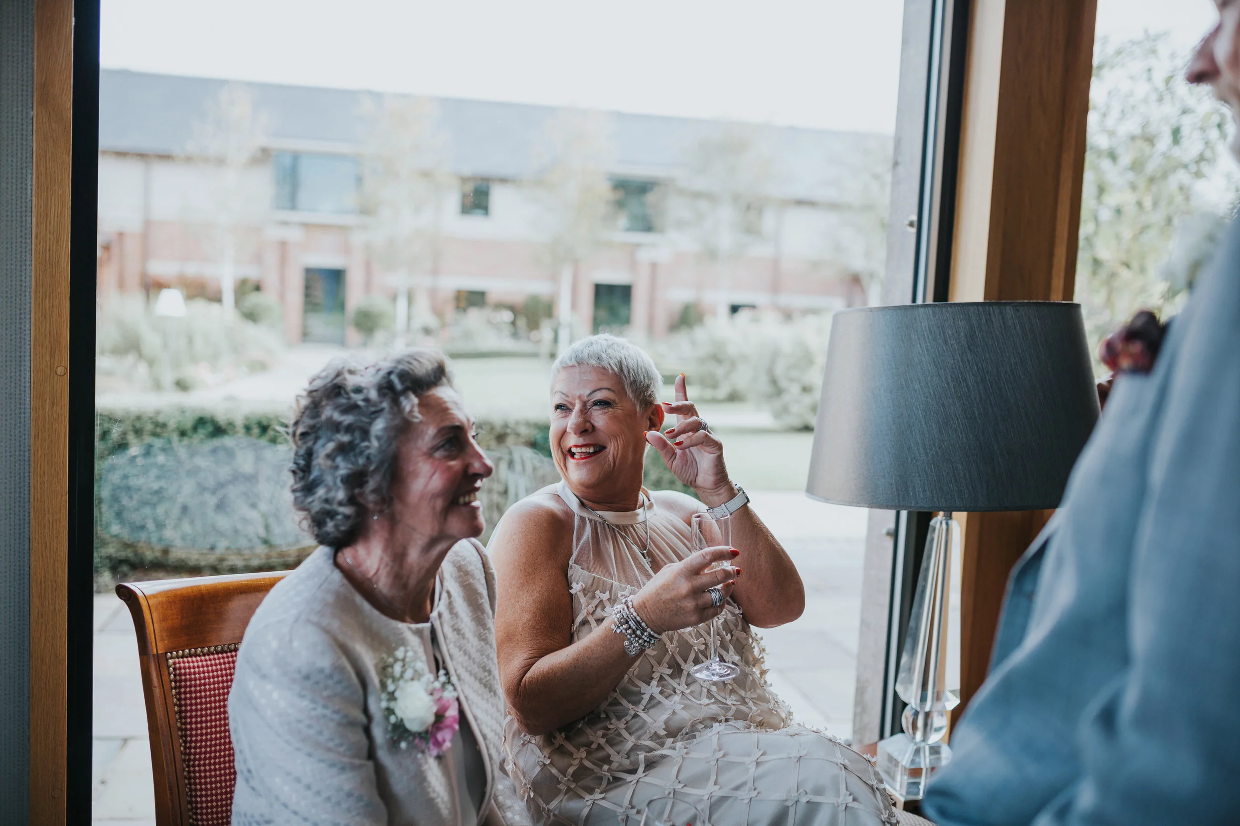 Wedding guest laughs. 
