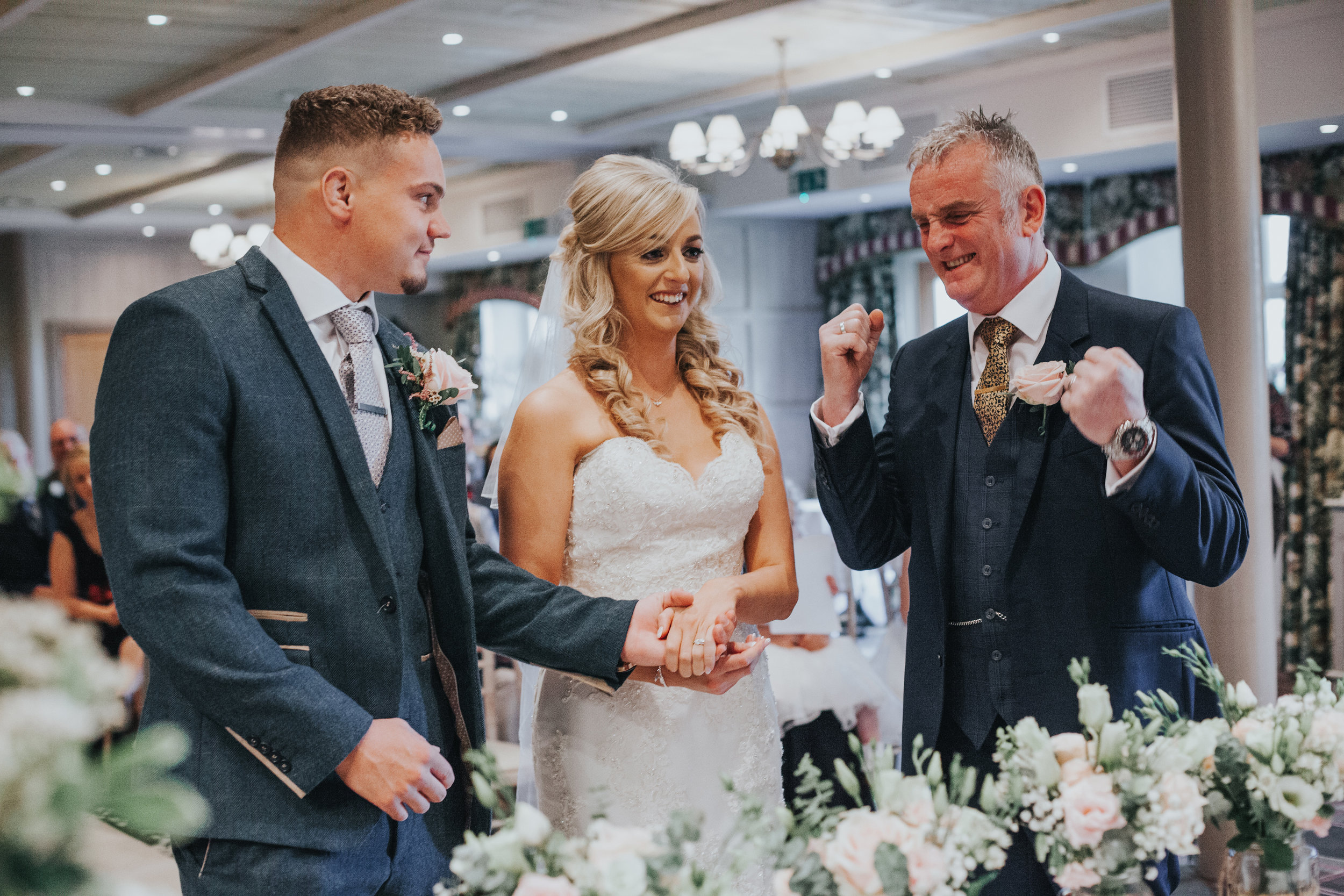 Father of the bride looks very excited about giving his daughter away...