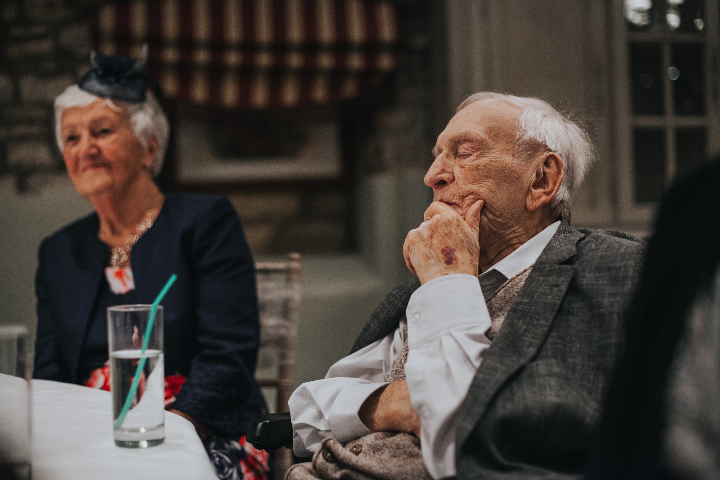 Grandad is having a sneaky sleep during the speeches.