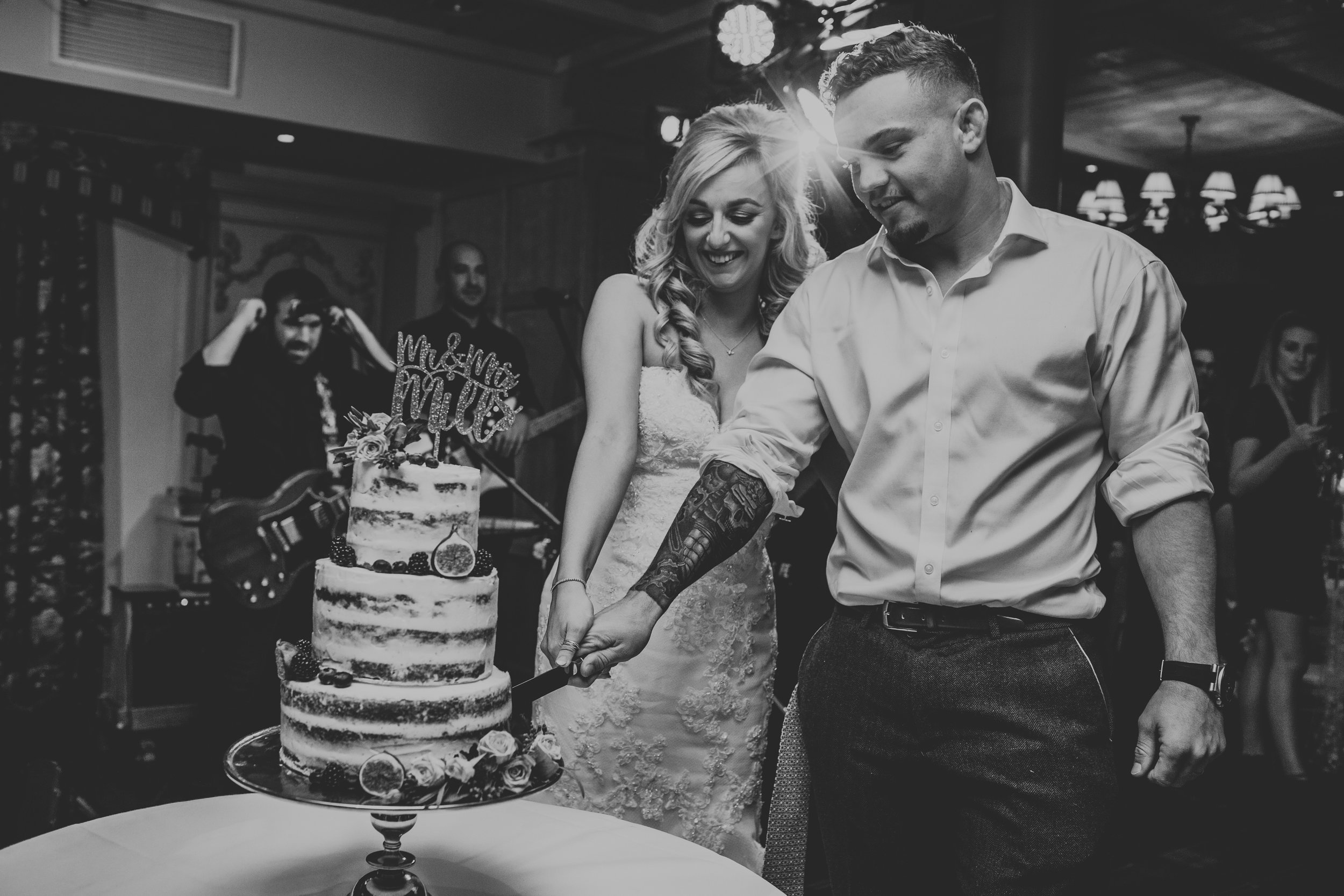 Bride and Groom cut the cake. 