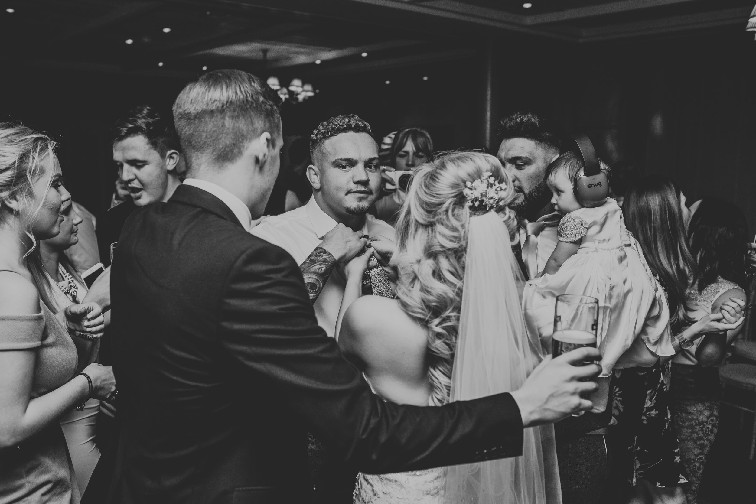 Guests join them on dance floor.