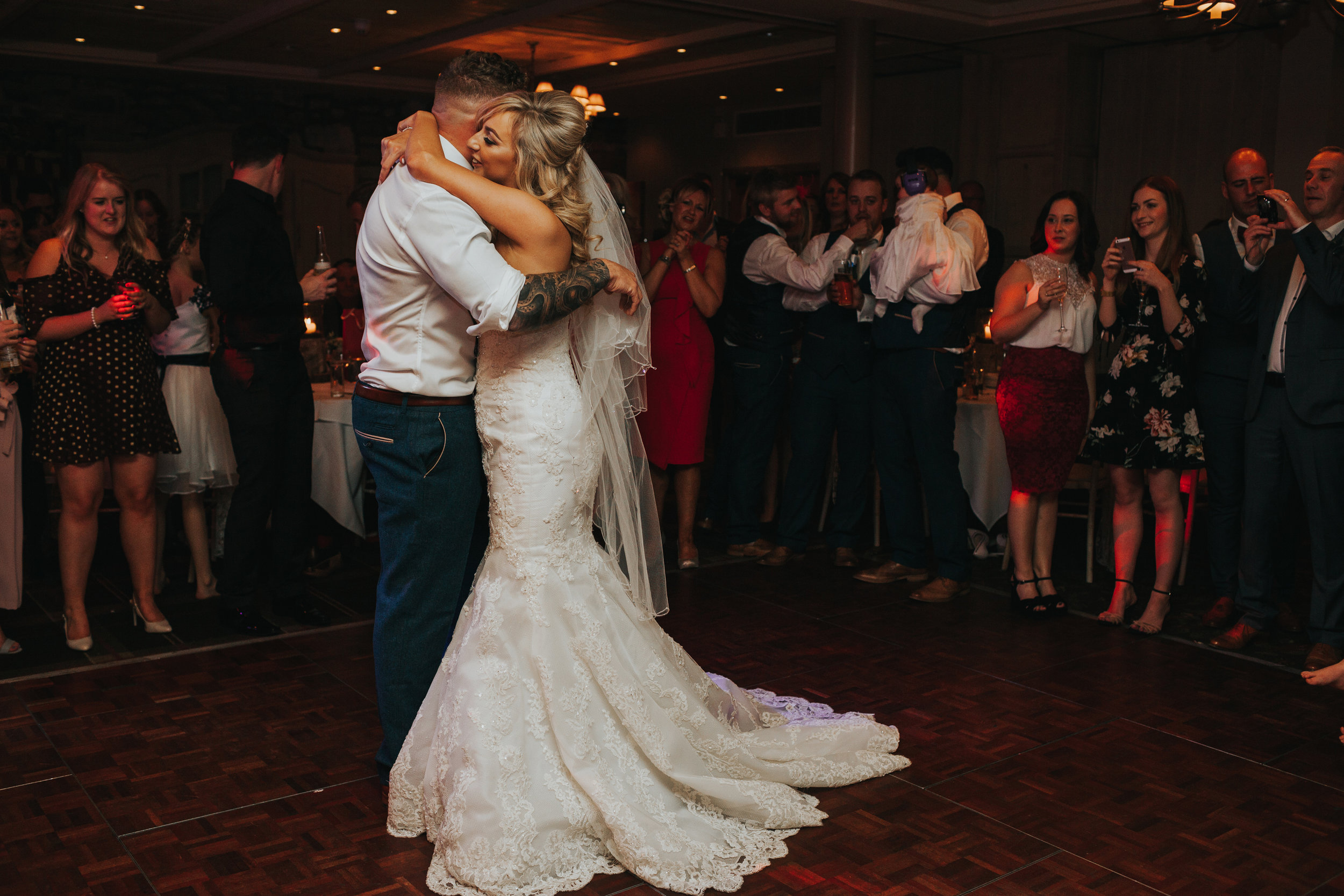 Bride and groom dance together alone. 