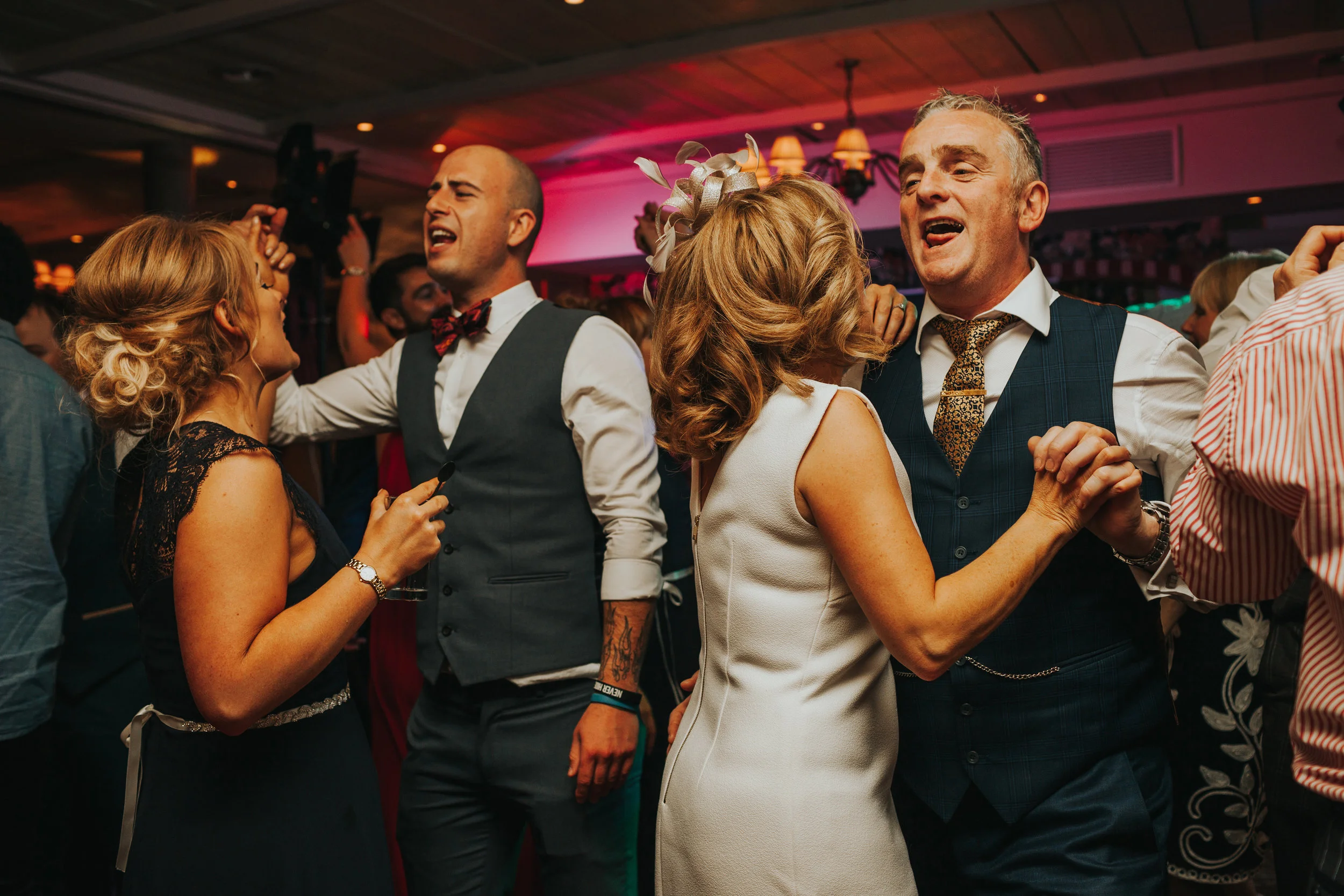 Parents of the bride dance together. 