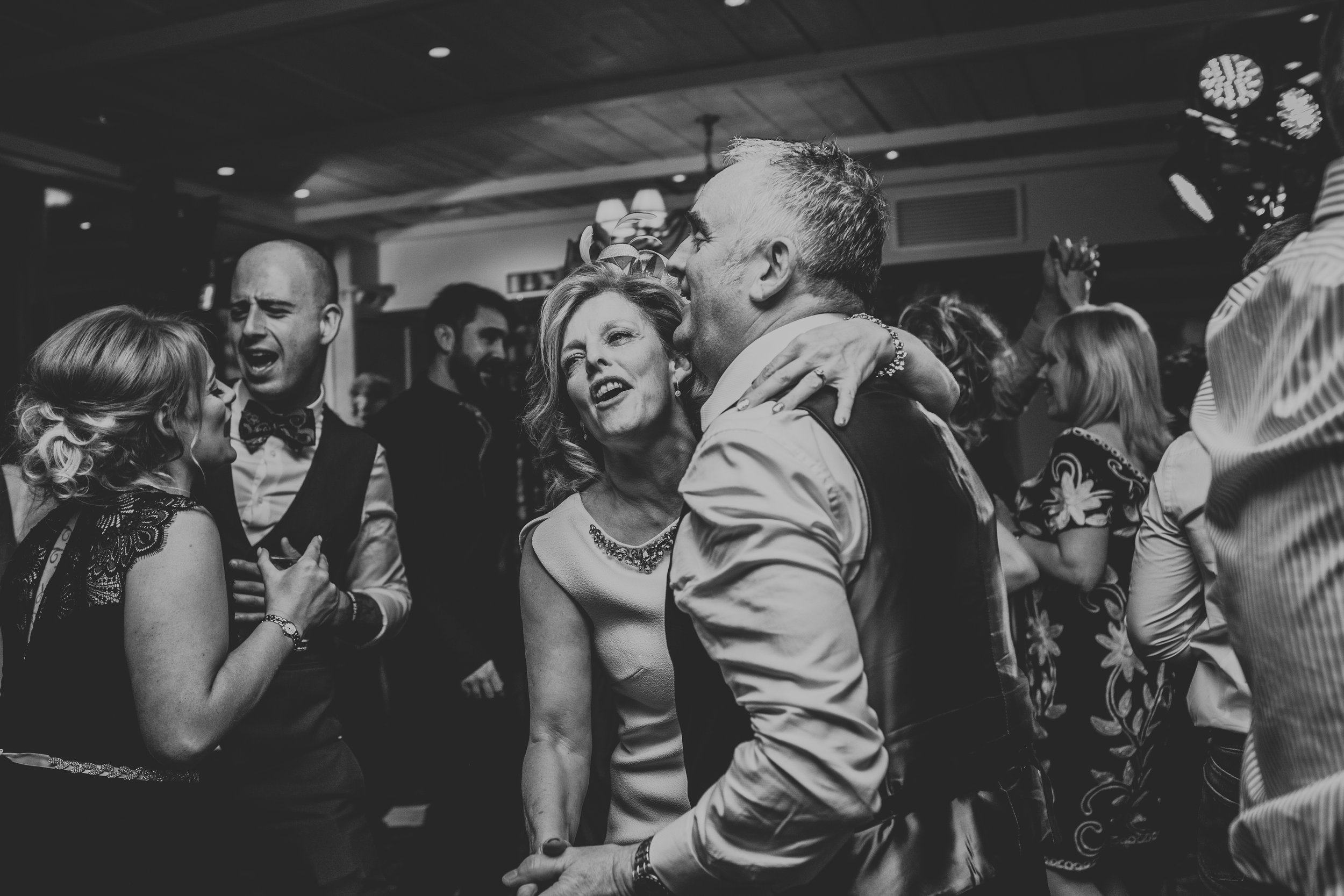 Mother and father of the bride dancing together.
