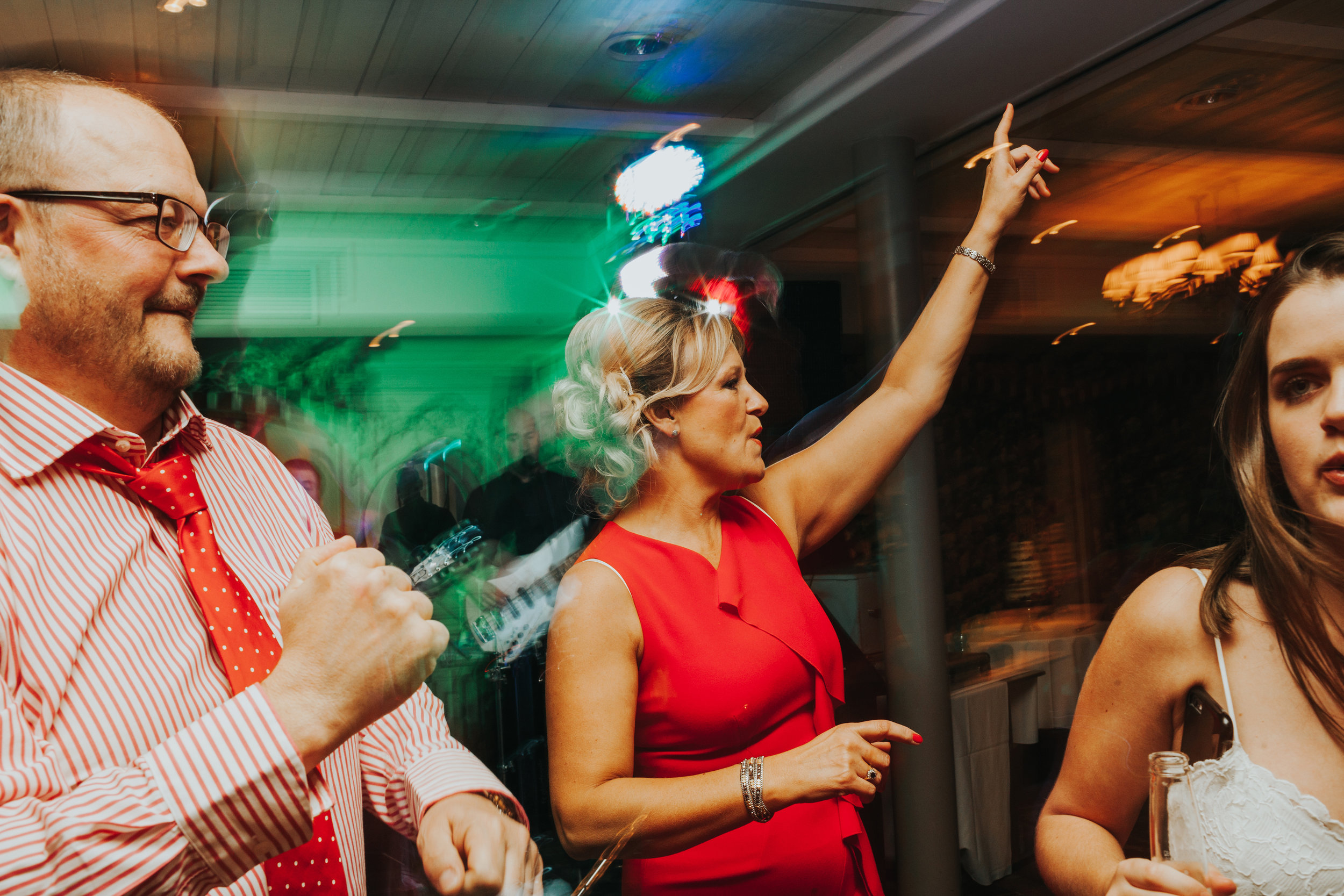 Guests dancing, slow shutter speed effect.