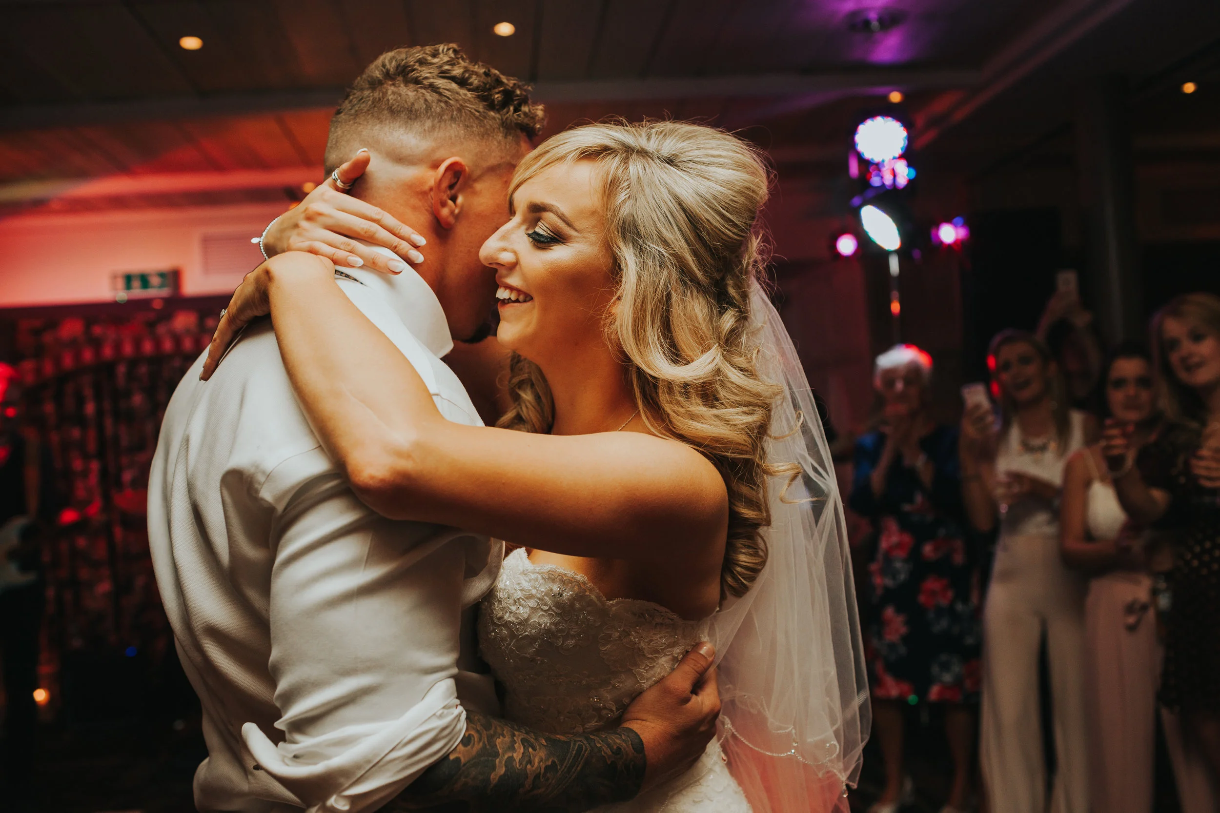 Bride and Groom holding each other. 